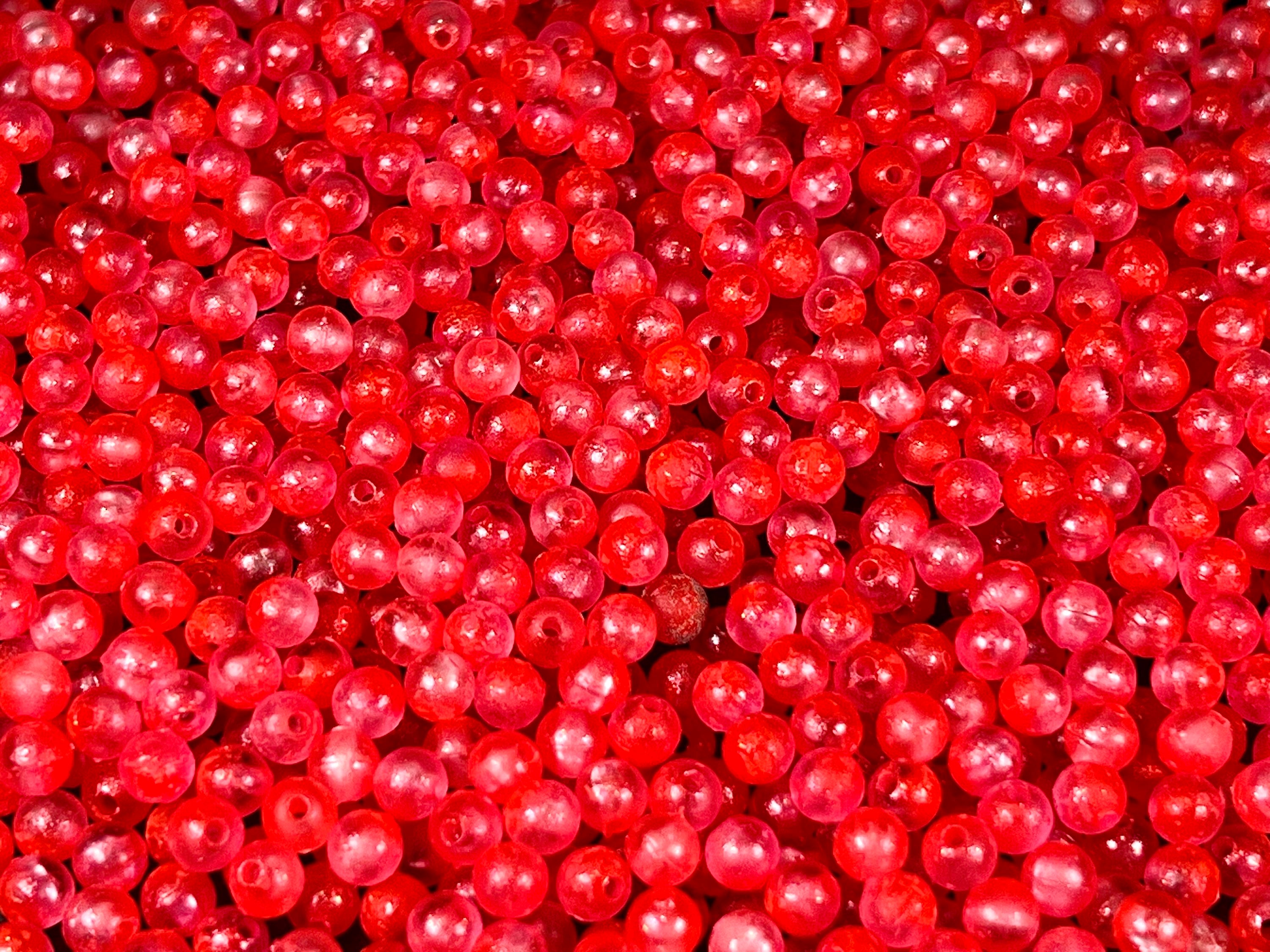 Cherry Freeze UV fishing beads, dense pile of red plastic round beads with holes