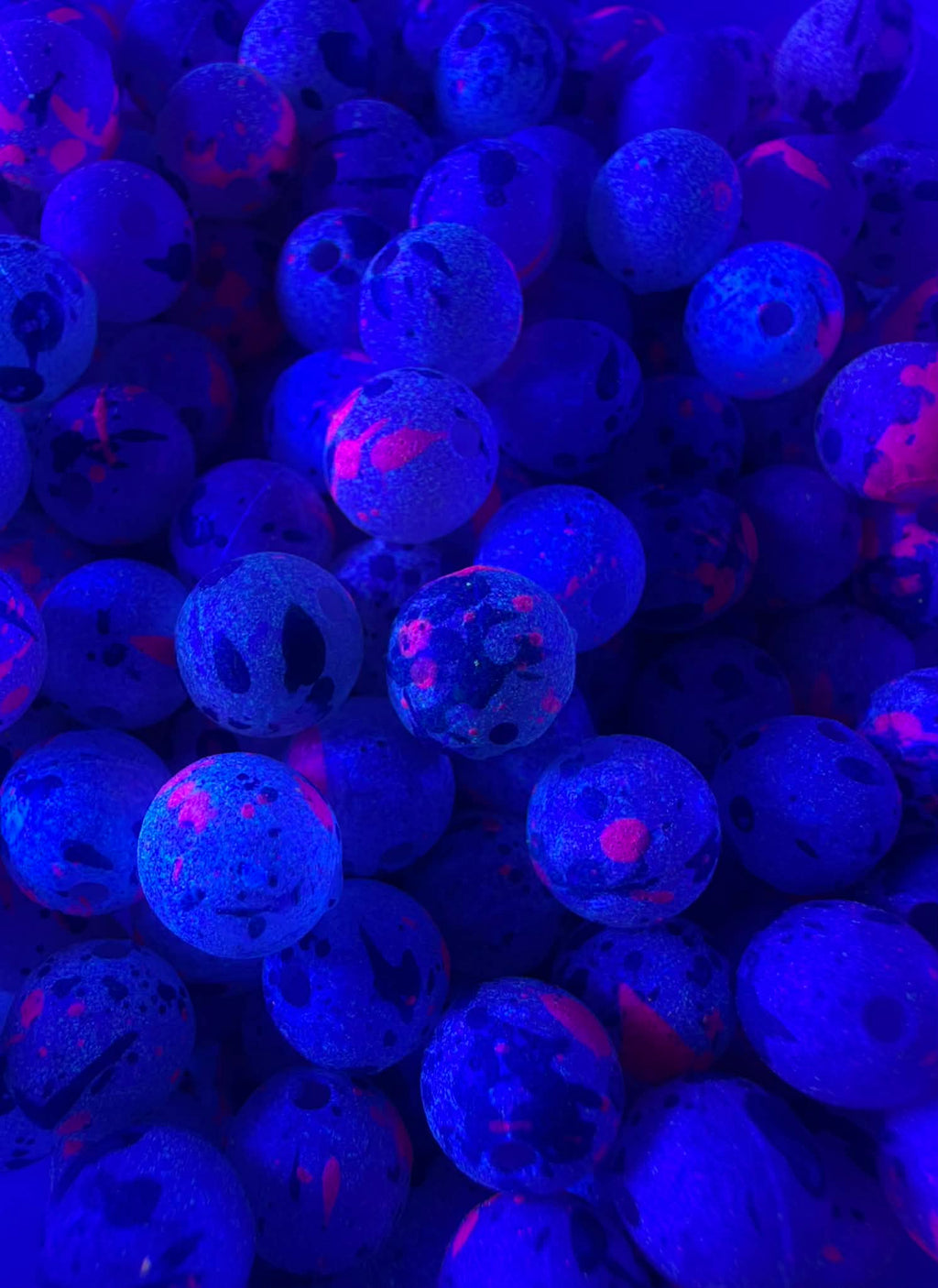 UV glow plastic fishing beads, bright blue with pink highlights