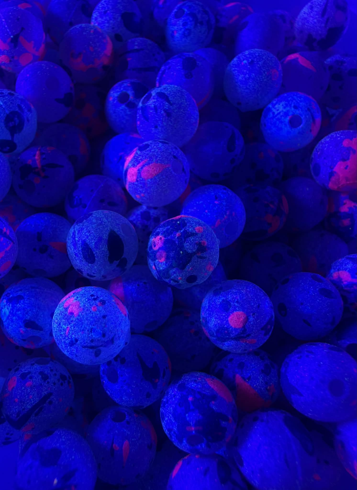 UV glow plastic fishing beads, bright blue with pink highlights