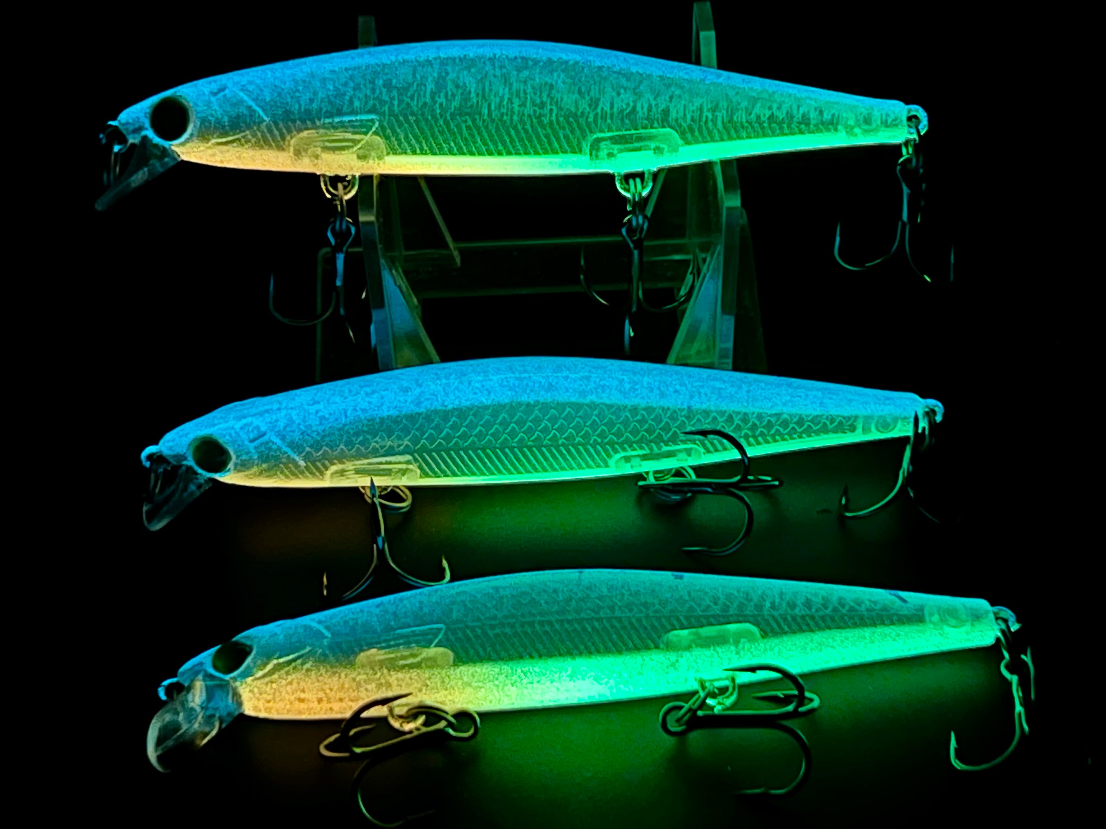 Glow suspending jerkbaits, 3-pack: blue-green bodies with treble hooks