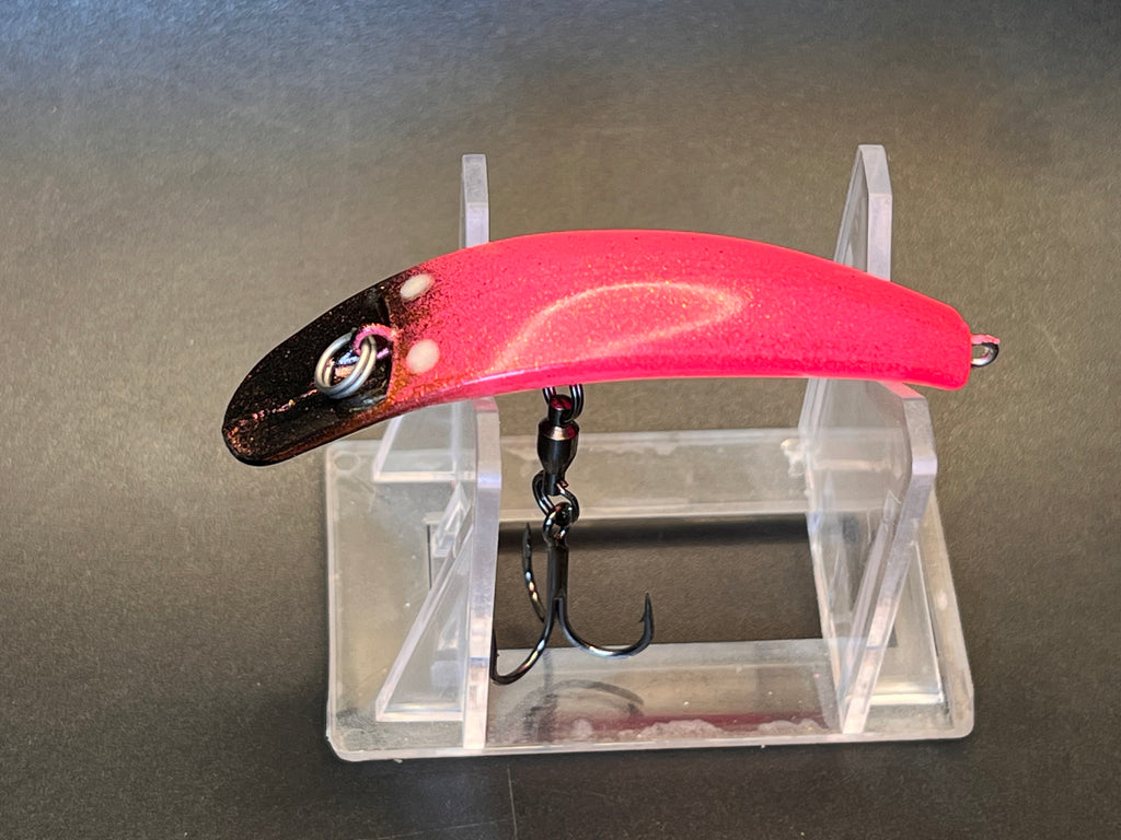 Red and black fishing lure with lip and two treble hooks