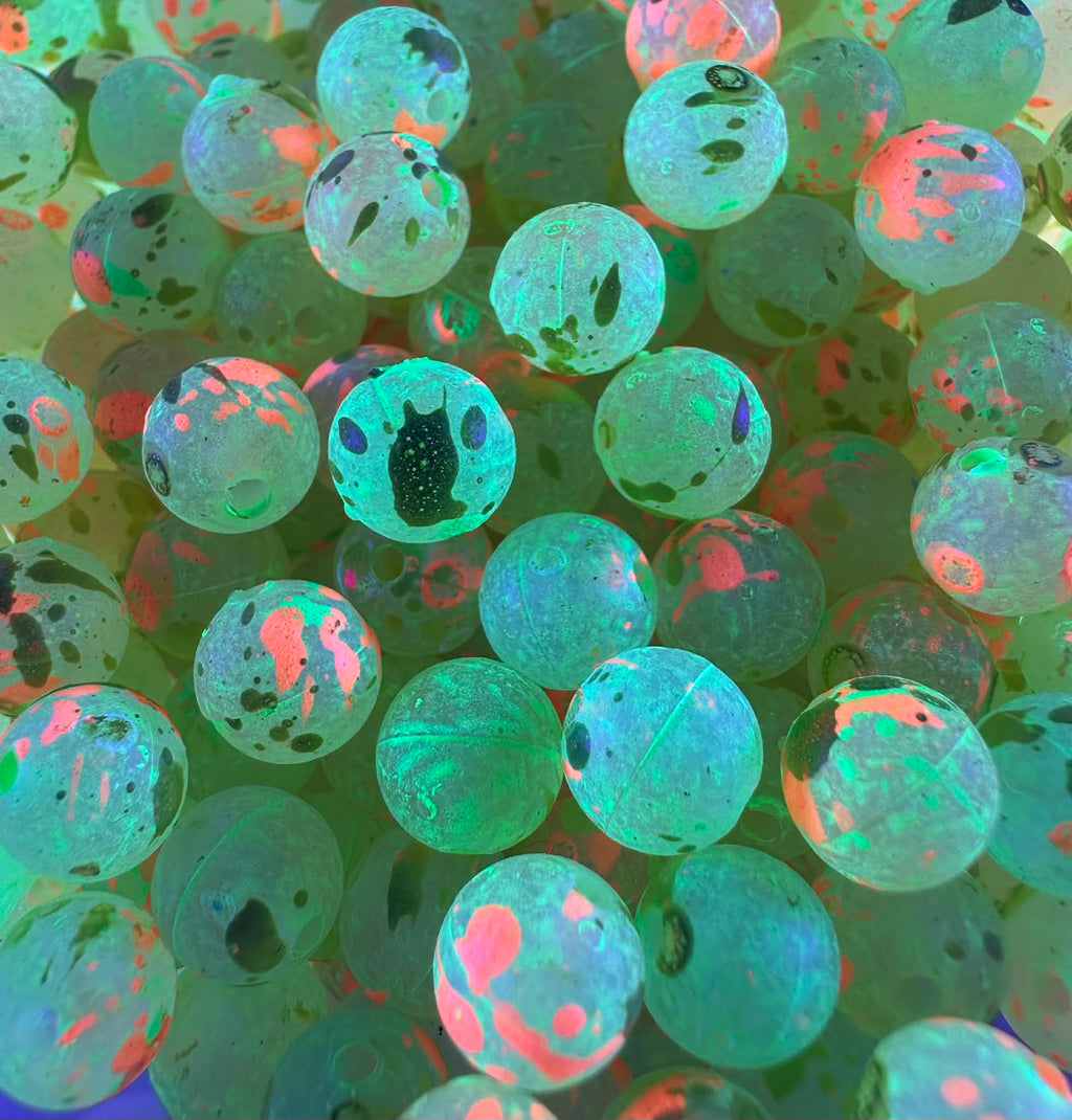 UV-glow fishing beads, turquoise-green with orange spots and dark dot specks
