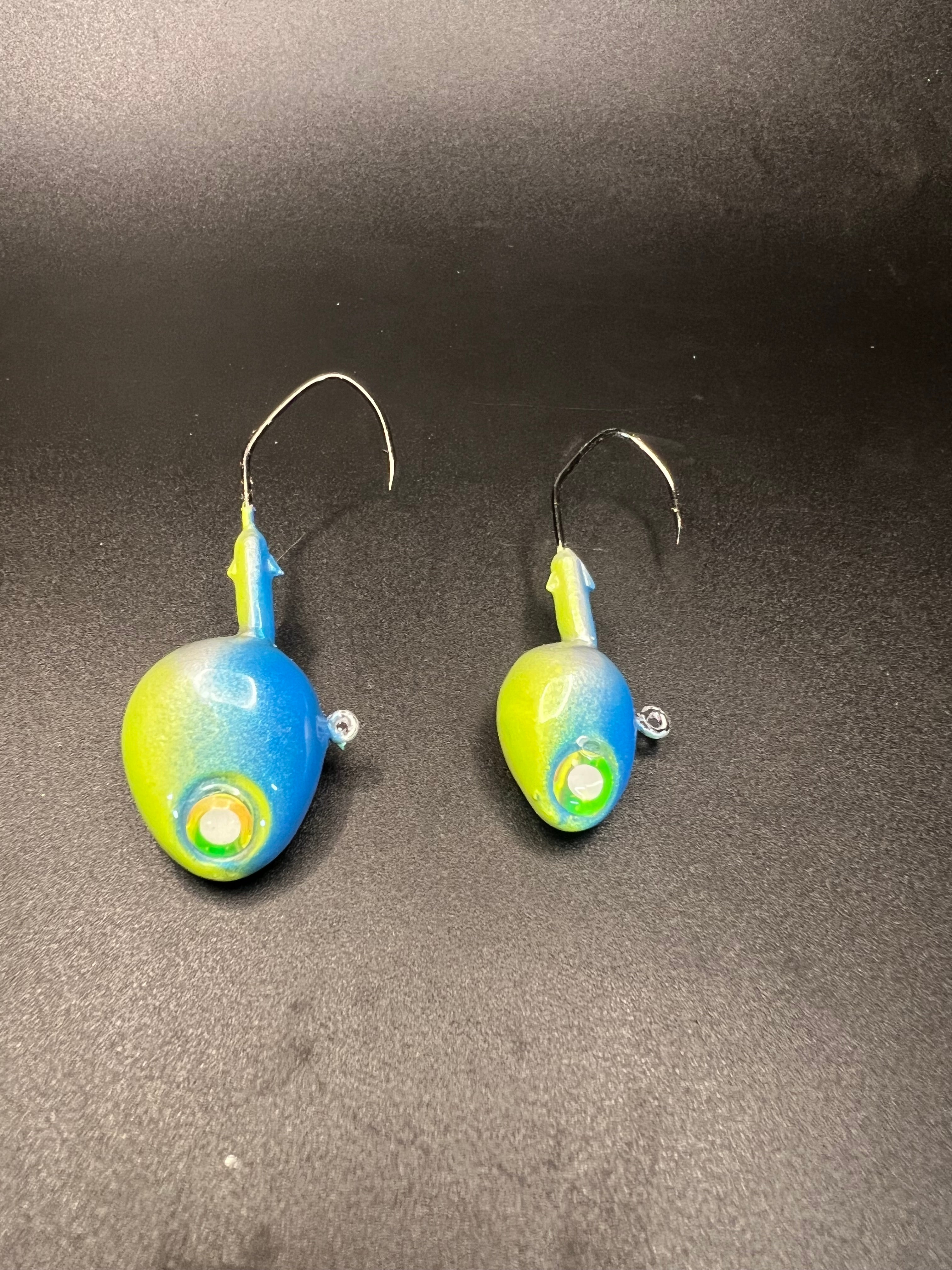 Two UV walleye jigs with blue-green heads, chartreuse bodies, two hooks