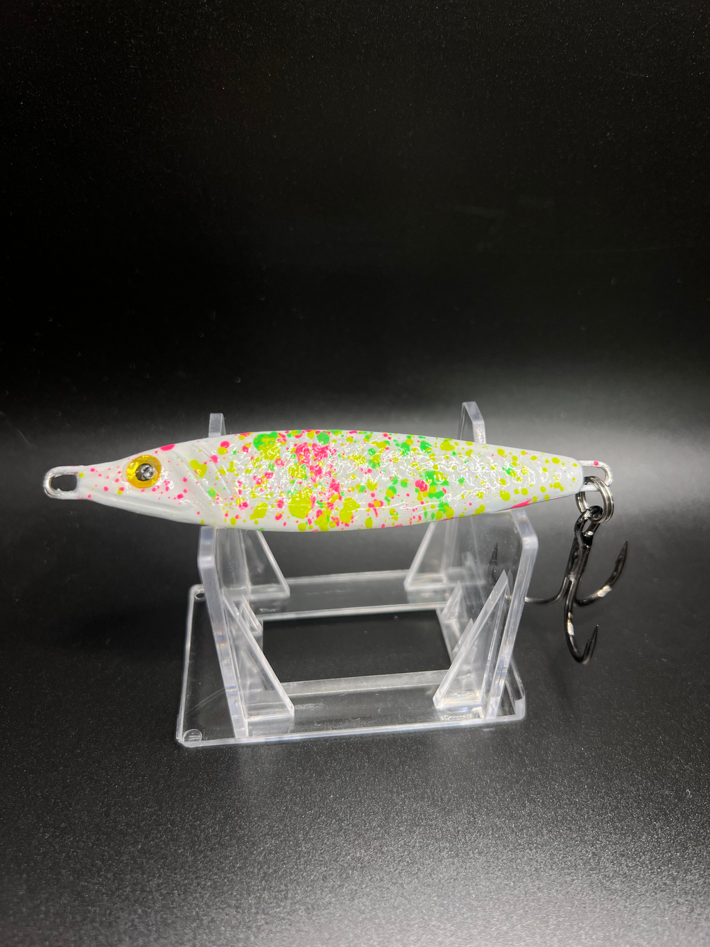 UV glow jigging spoon, 2 oz, white with multicolor speckled pattern and front hook