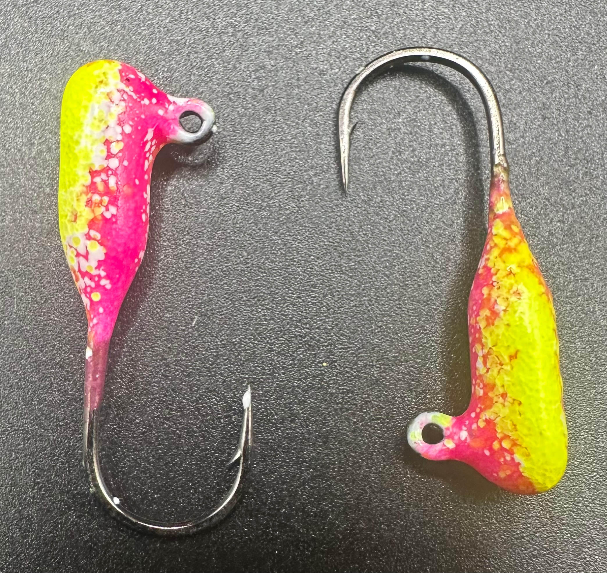 Tube jigs with neon pink and chartreuse painted bodies and steel hooks