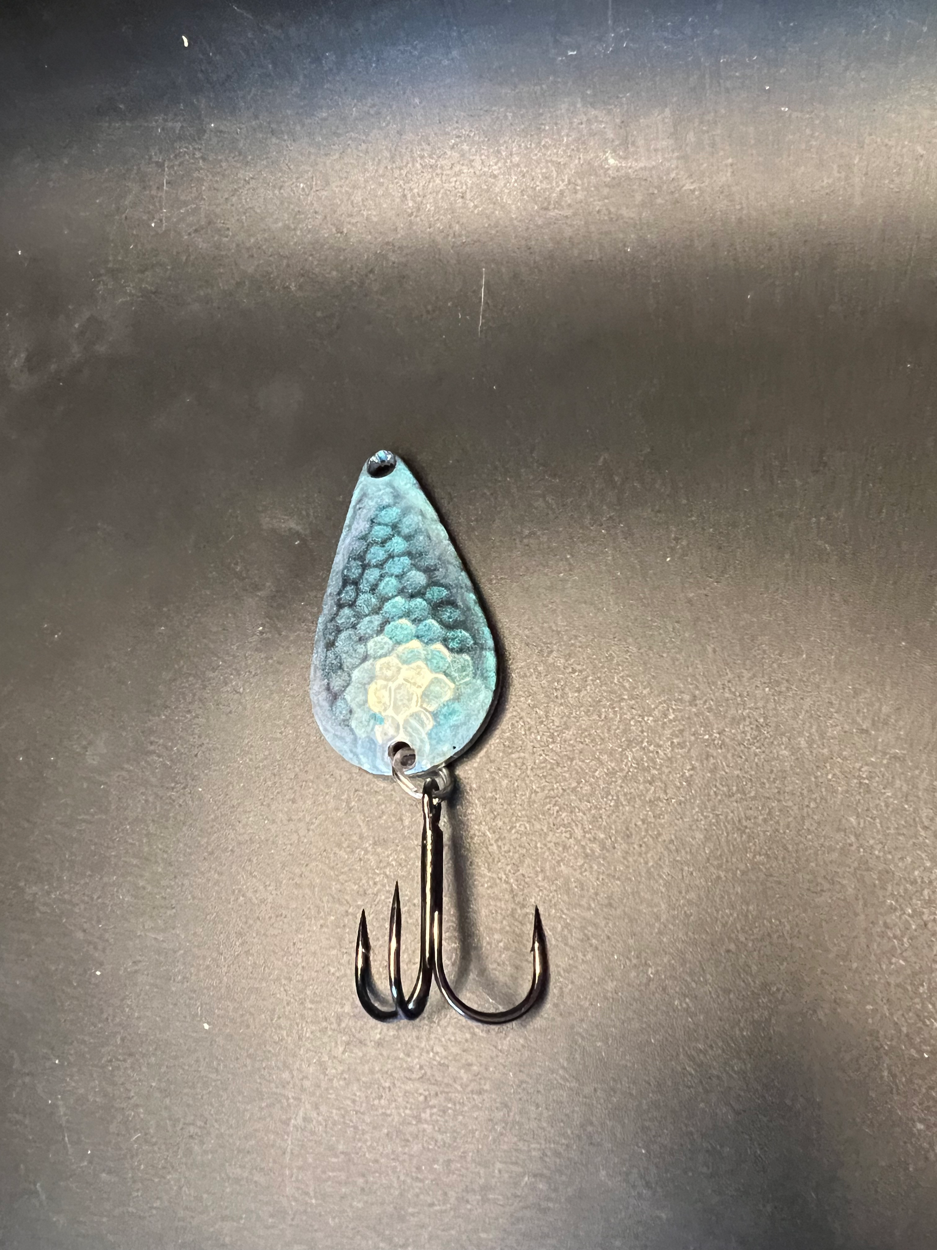 Blue Spoon Shoes TJ bobbler fishing lure with blue textured teardrop body and treble hooks