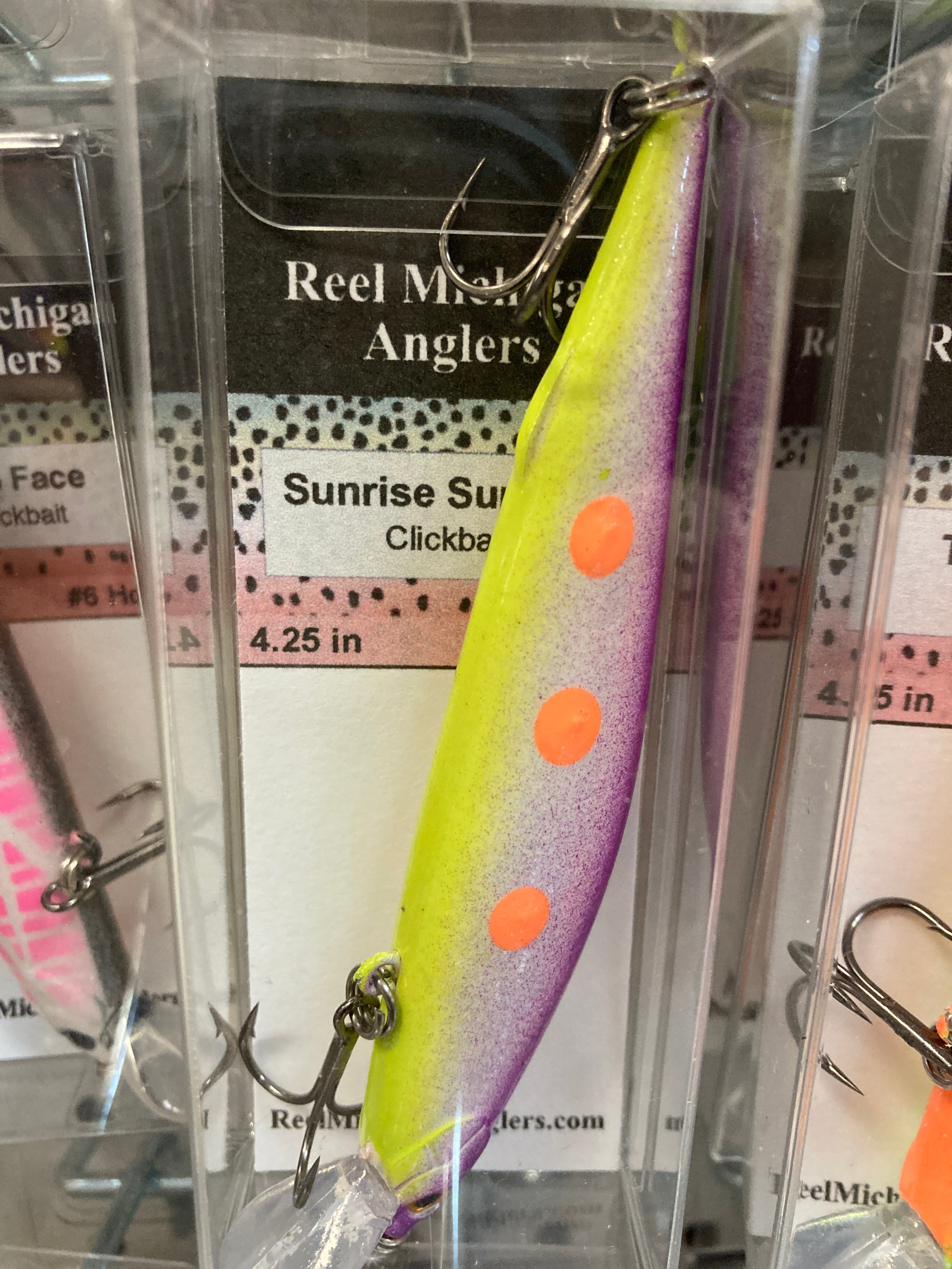 Gradient chartreuse to purple fishing lure with orange dots, treble hooks, 4.25 in.