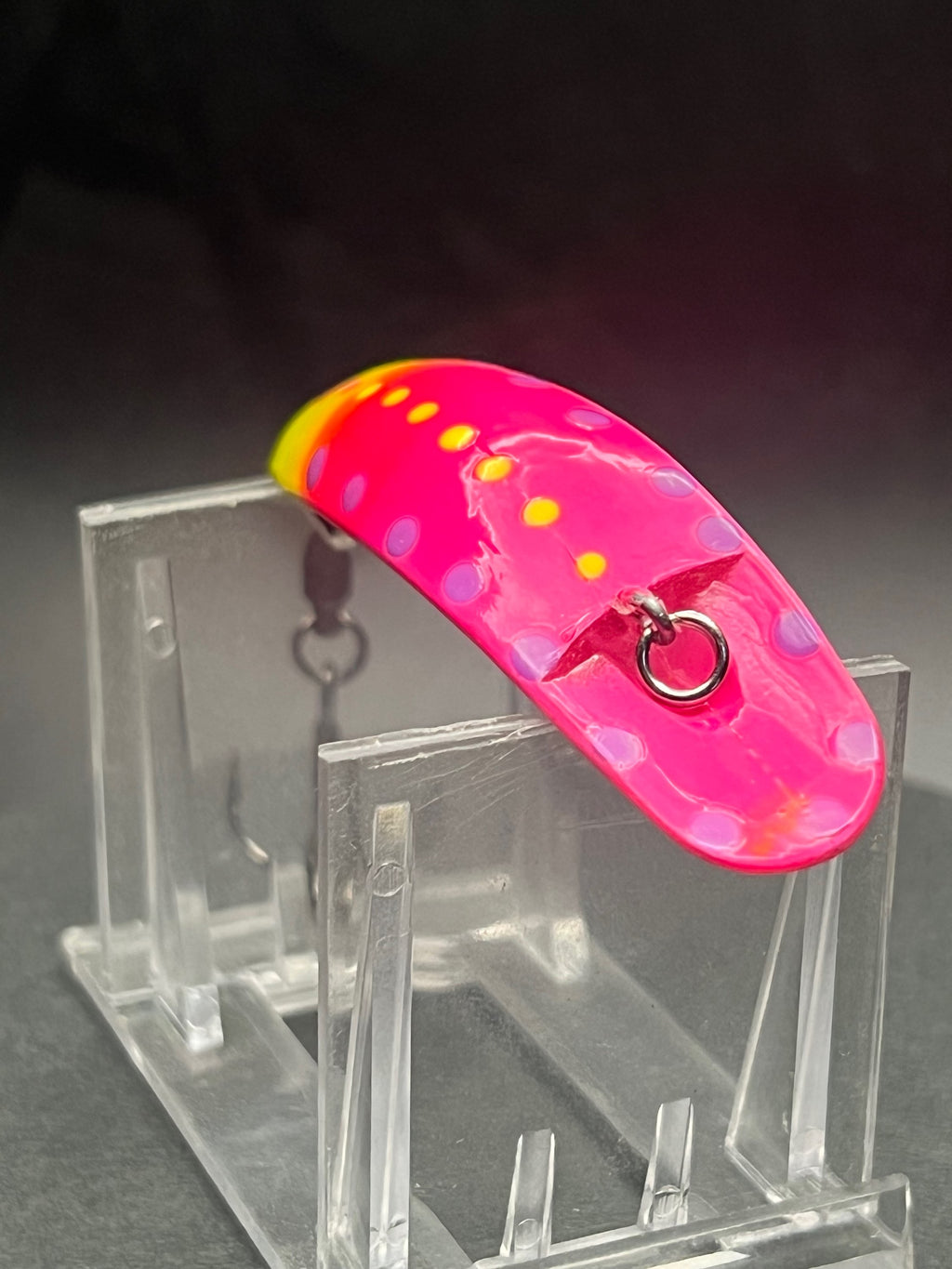Strawnana Swiftfish lure in pink with yellow spots and metal front eye, hook