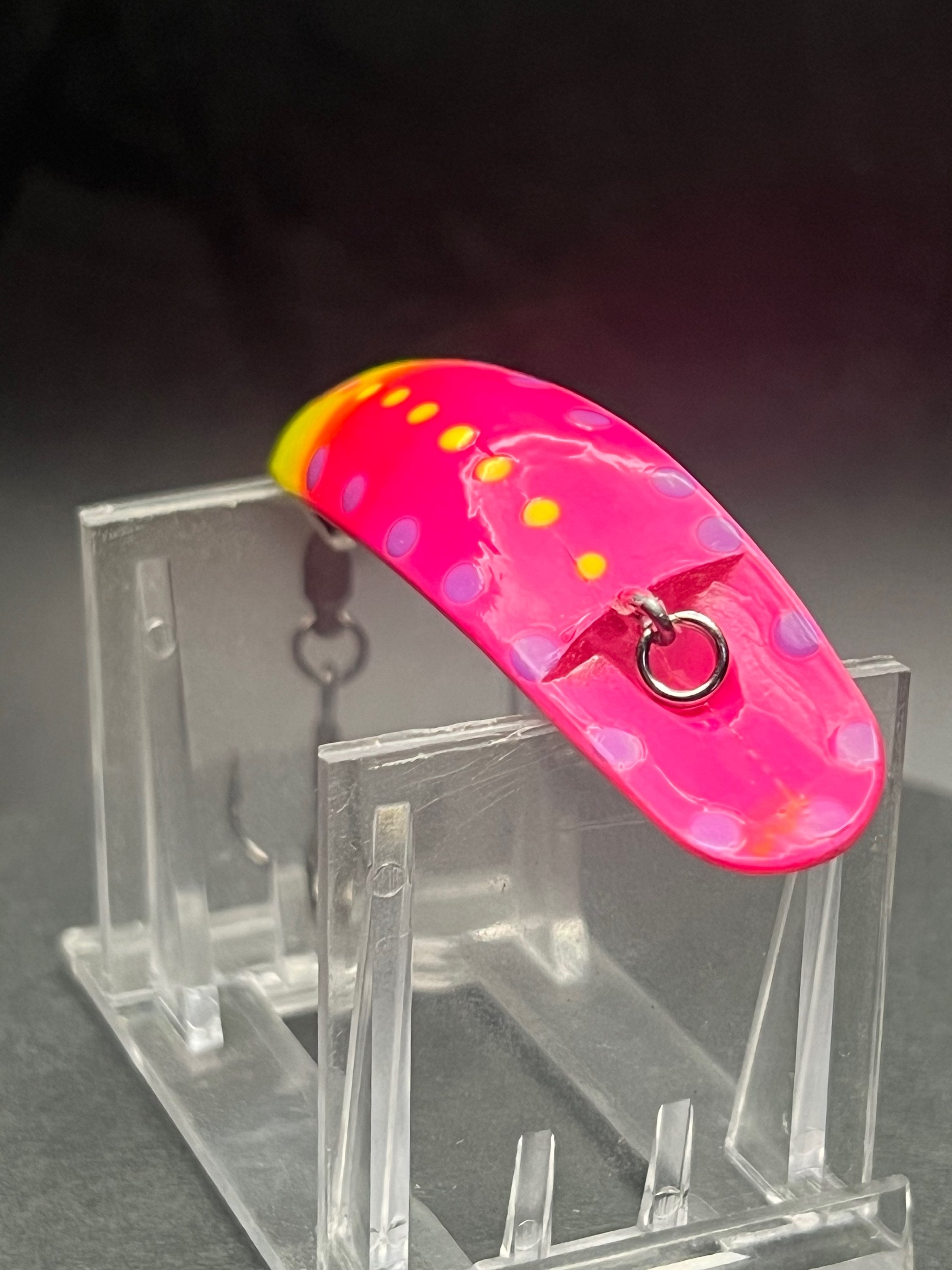 Strawnana Swiftfish lure in pink with yellow spots and metal front eye, hook