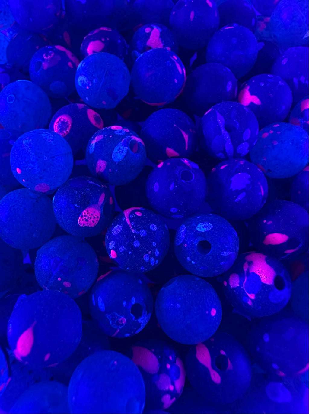 Acid Jazz UV glow fishing beads, blue plastic with magenta speckles and round holes