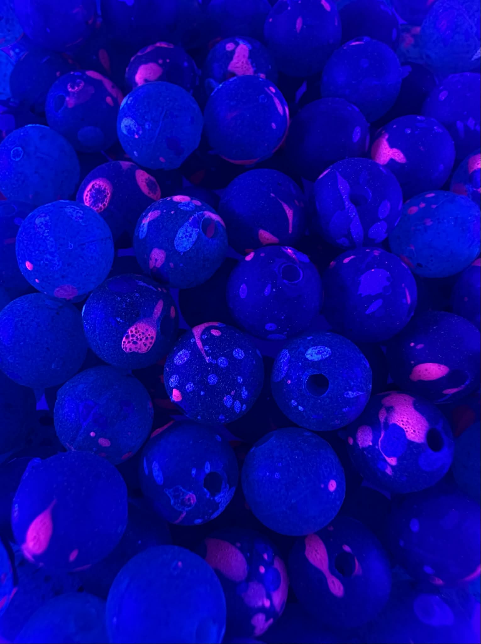 Acid Jazz UV glow fishing beads, blue plastic with magenta speckles and round holes