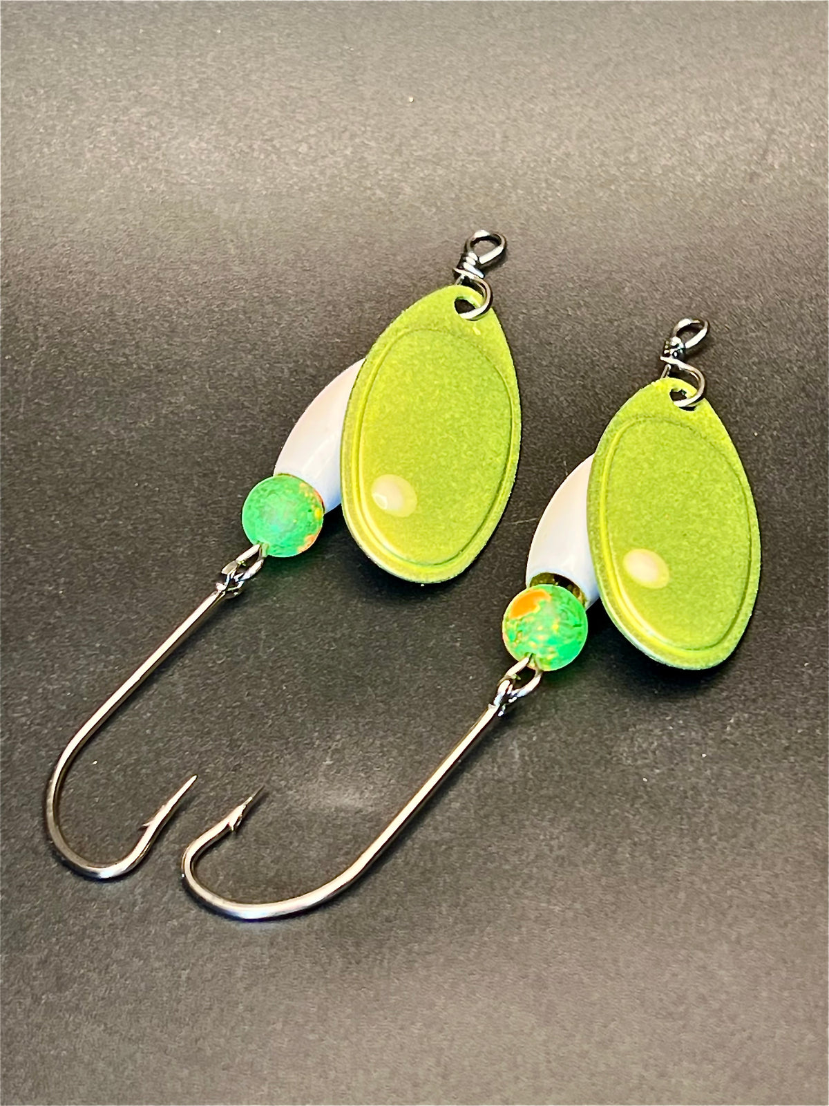 Lime green glow-in-the-dark inline spinner with teardrop body, white side, hook