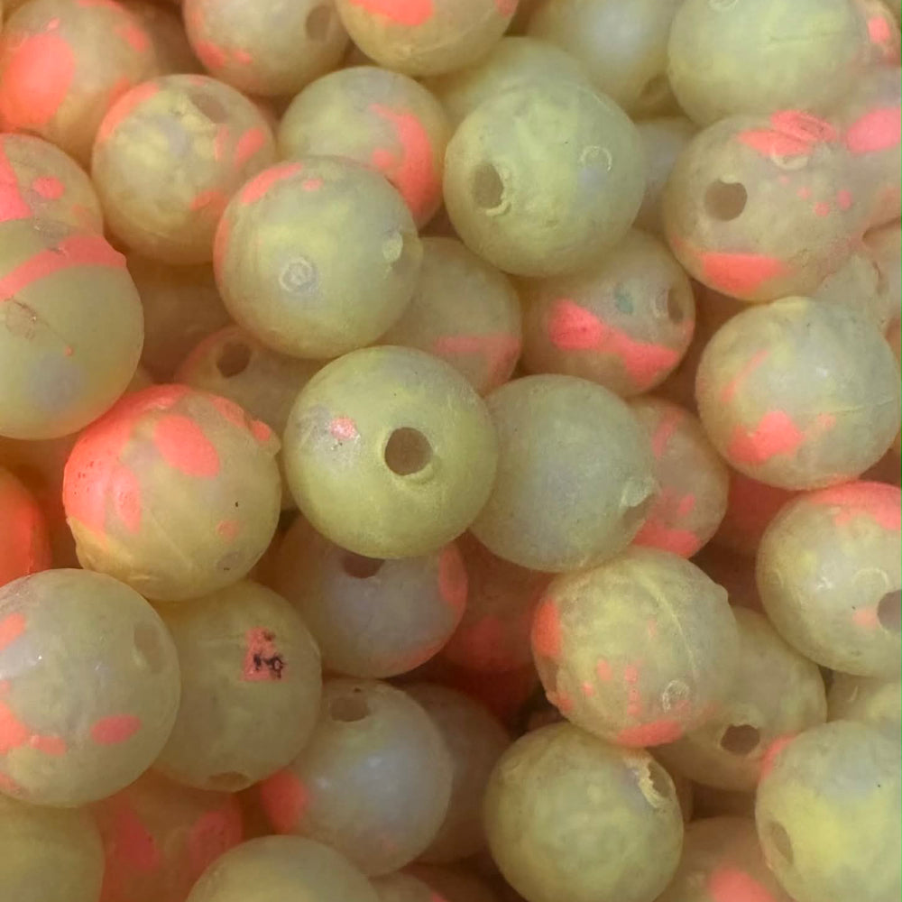 UV glow plastic fishing beads, pale green with red speckles and center holes