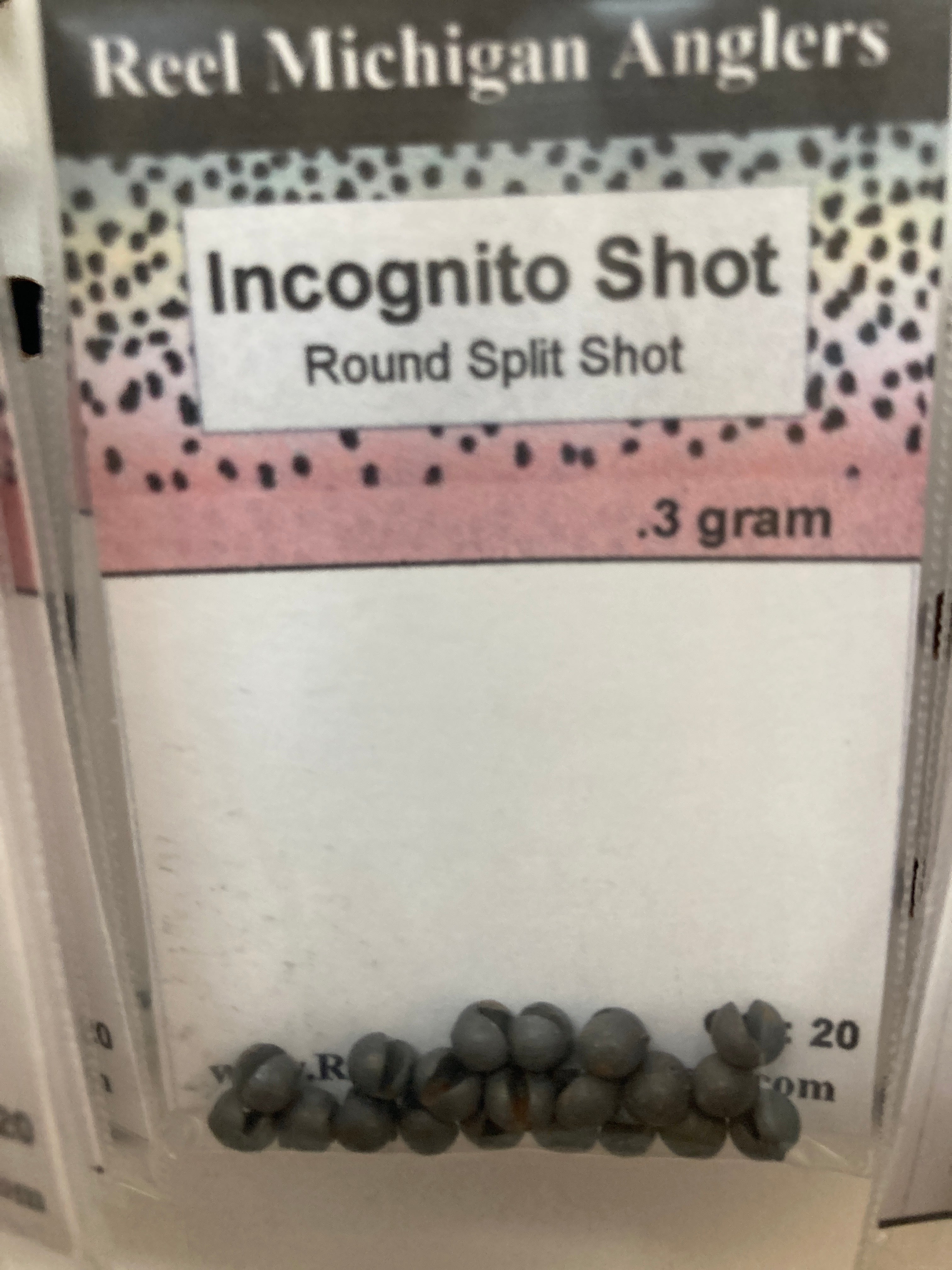 Fishing split shot sinkers, dark gray round shot pack labeled 3 gram