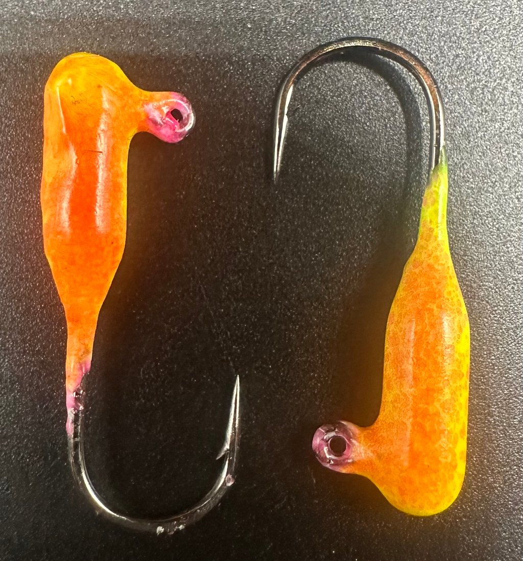 Two orange-yellow tube jigs with hooks, Lava Indestructible Paint Series