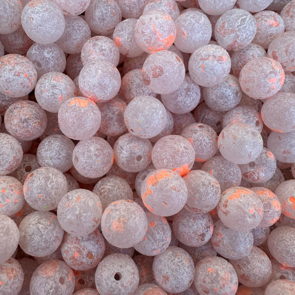 Peach Pit UV glow plastic fishing beads, frosted white with orange specks