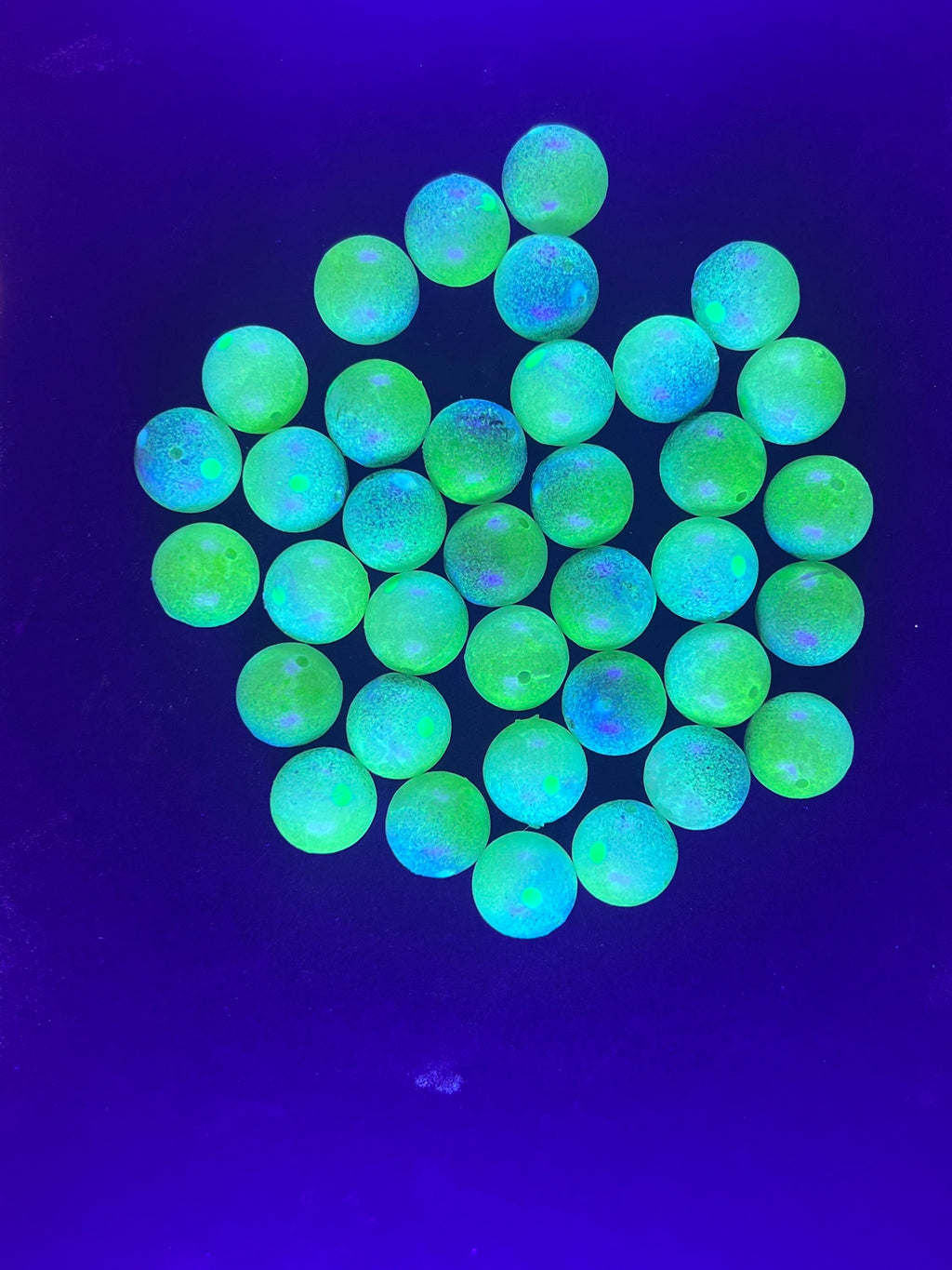 14mm UV glow plastic beads in bright green, blue UV-lit sparkle effect.