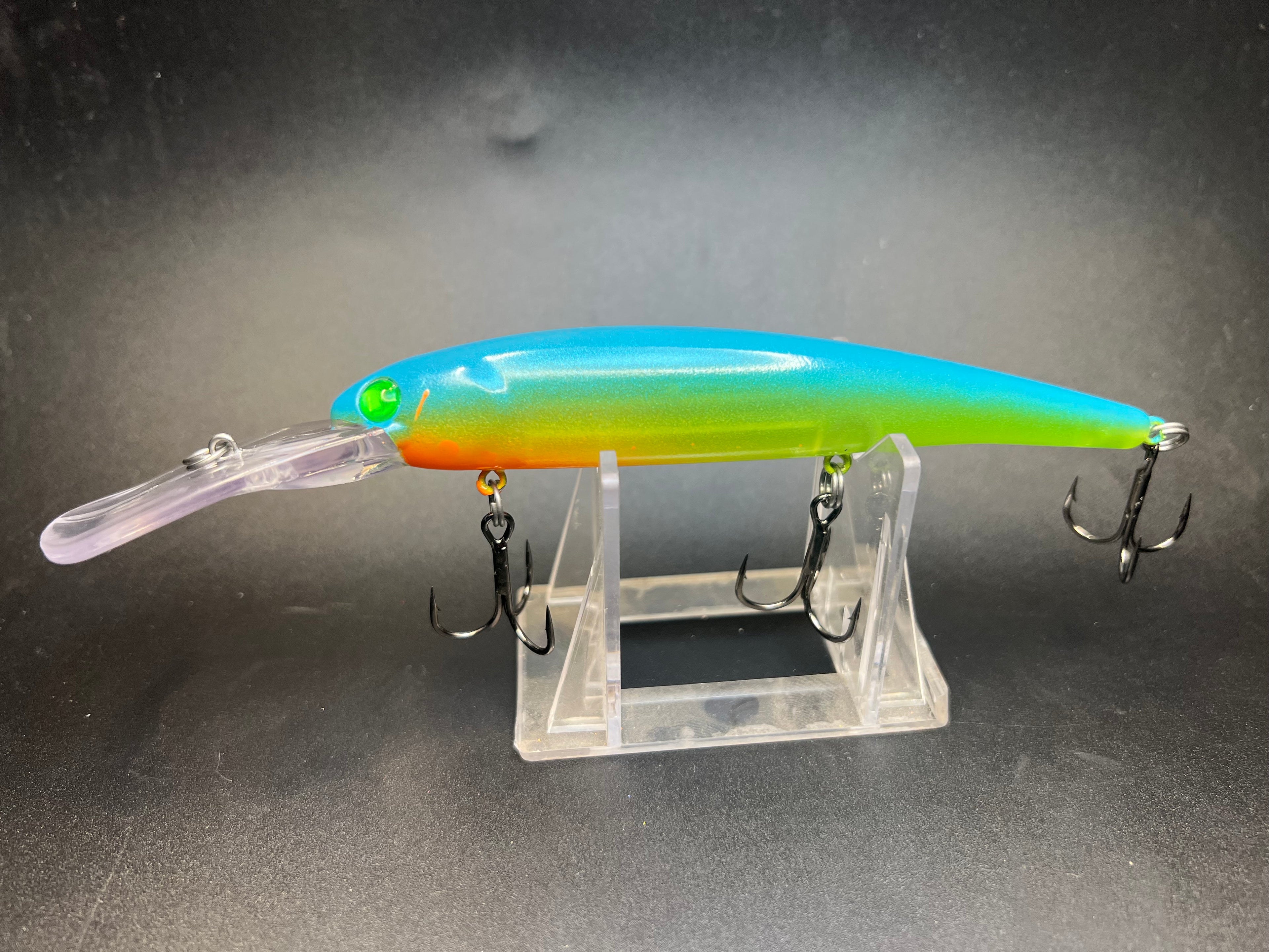 Chernobite UV glow walleye trolling lure with blue-green body, orange belly, three hooks