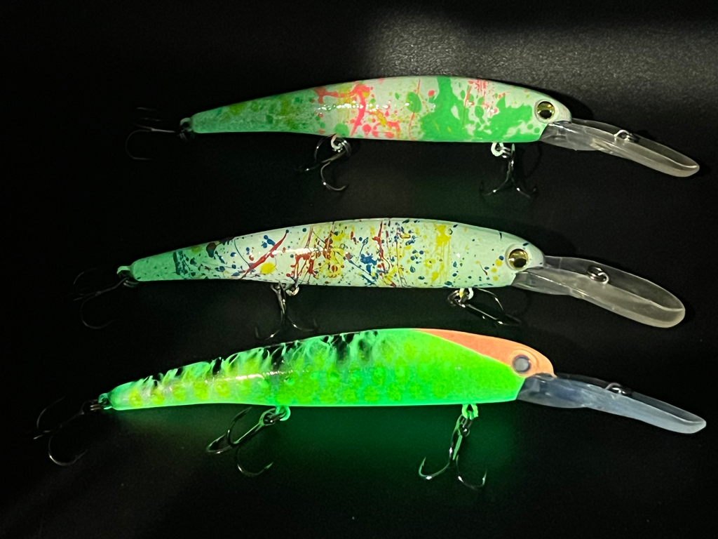 Assorted walleye trolling lures: green, multicolor, and orange with clear lips