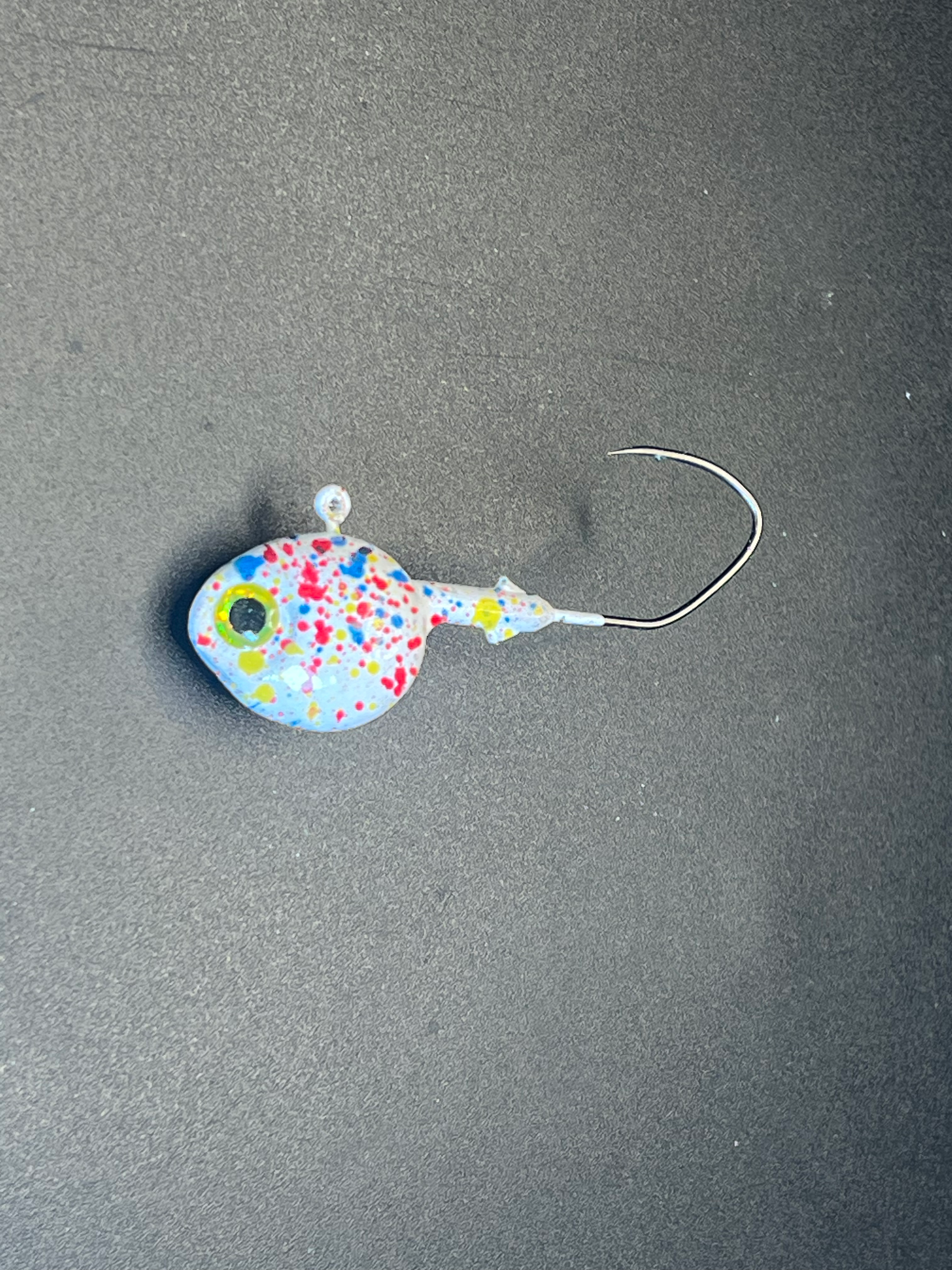 Splat UV walleye jig, speckled oval lure with single hook