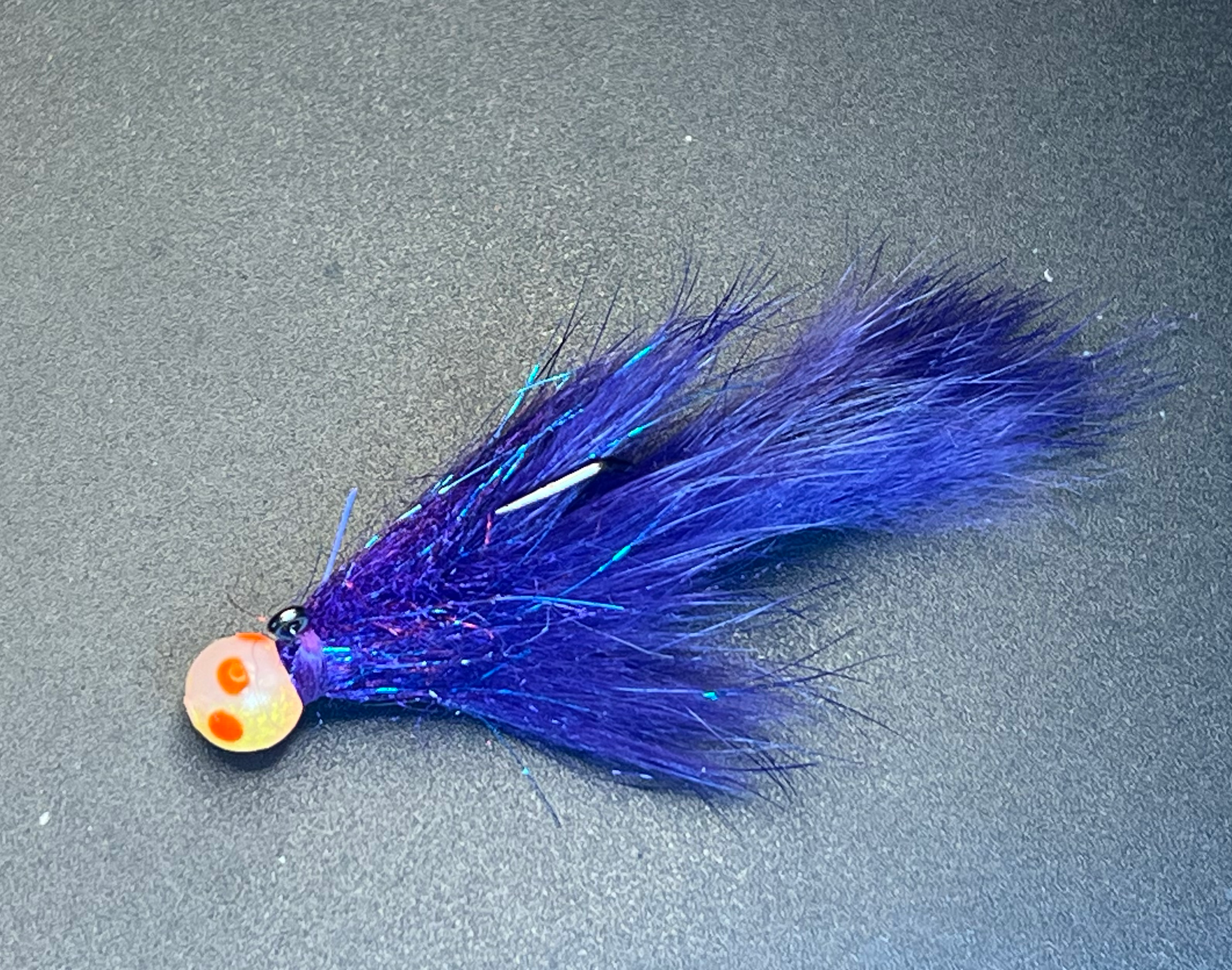 Purple blue hair fly with orange-spotted egg head and long fibers