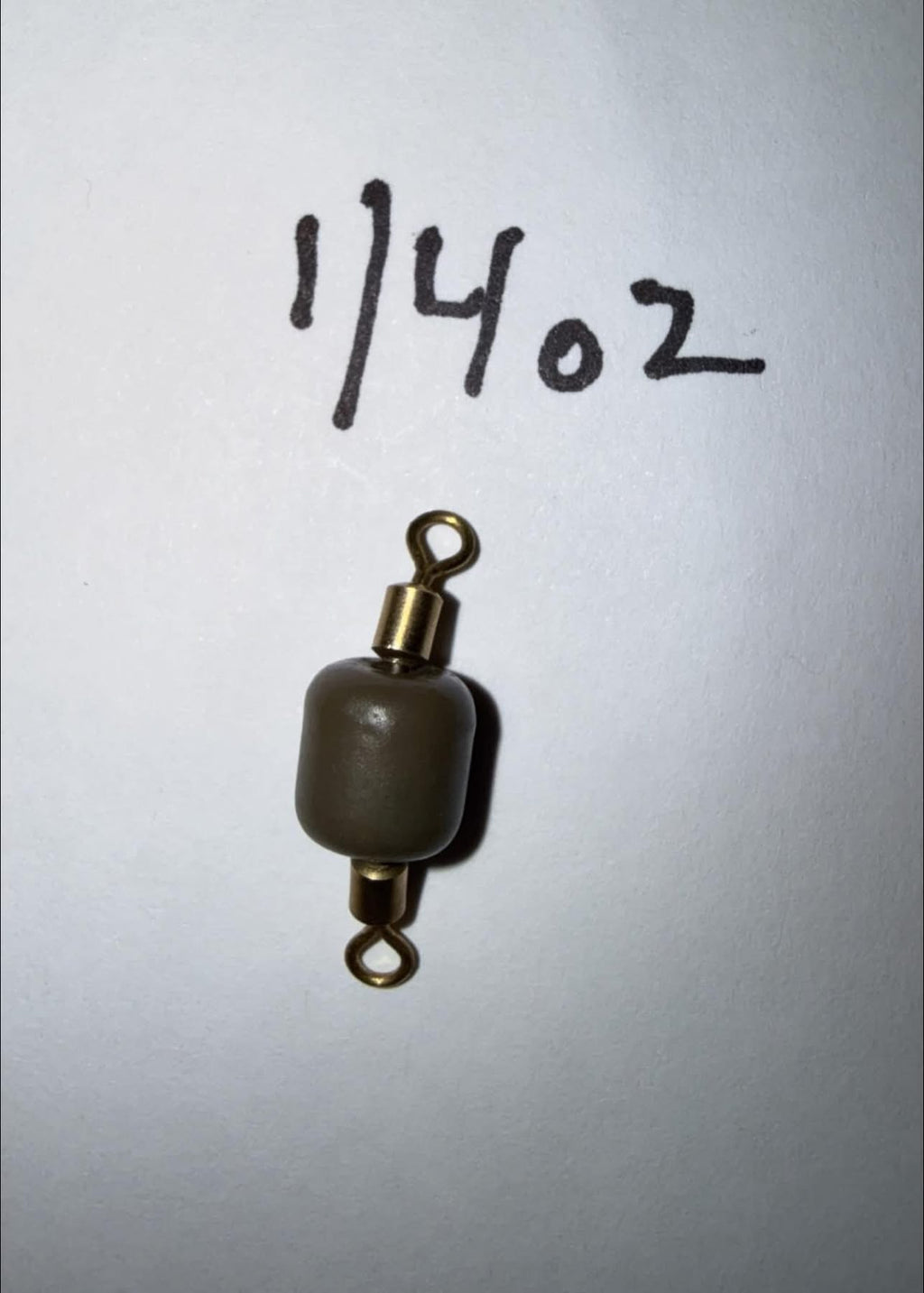 1/4 oz tungsten inline sinker with gold swivel and eyelets, dark gray