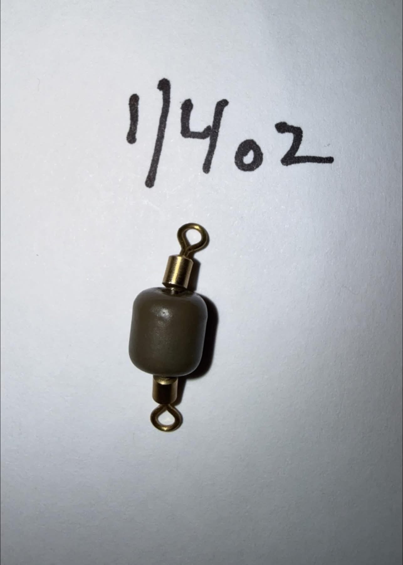 1/4 oz tungsten inline sinker with gold swivel and eyelets, dark gray