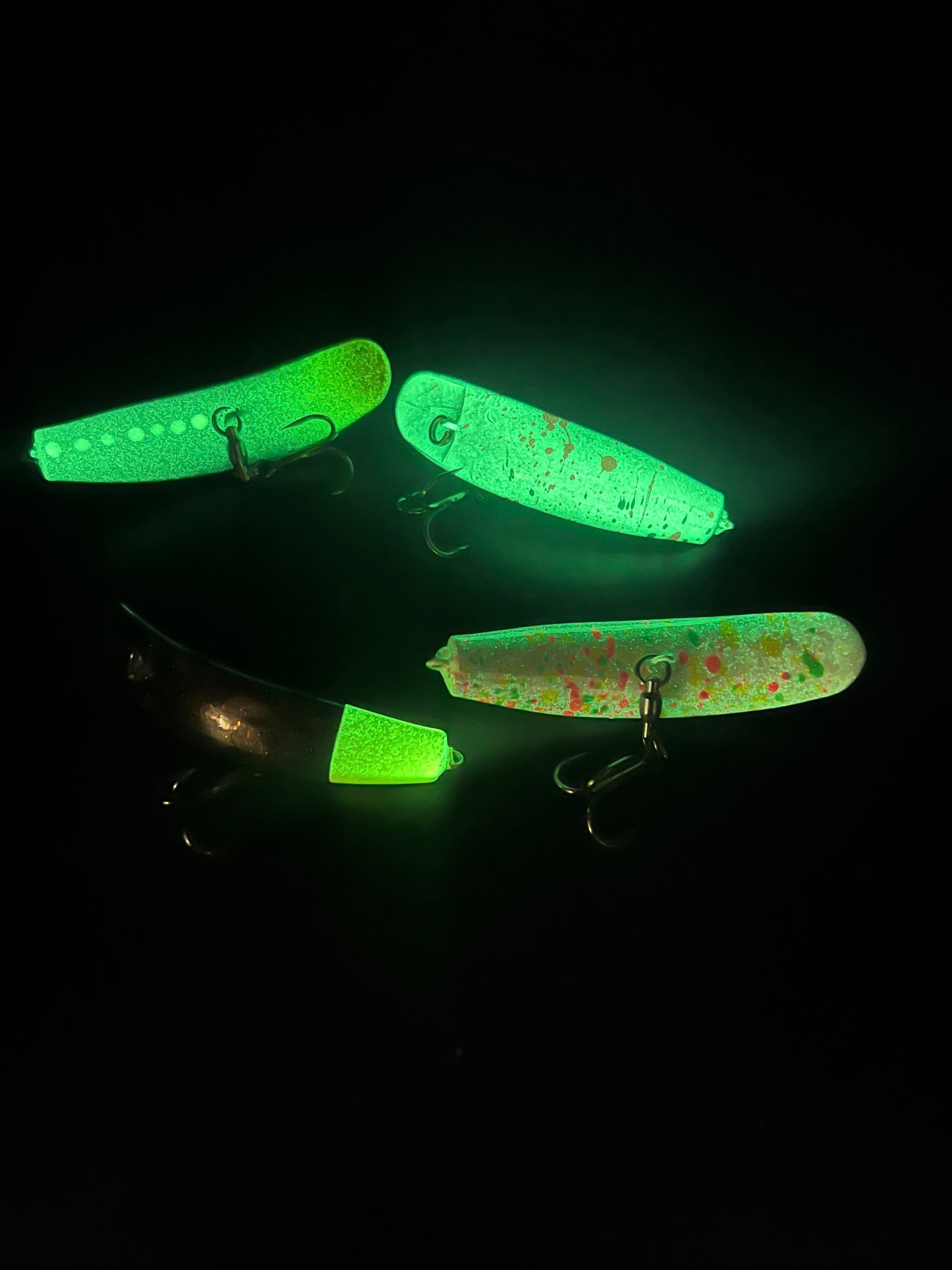 Neon green glowing Swiftfish lures, two hardbaits with fishing hooks