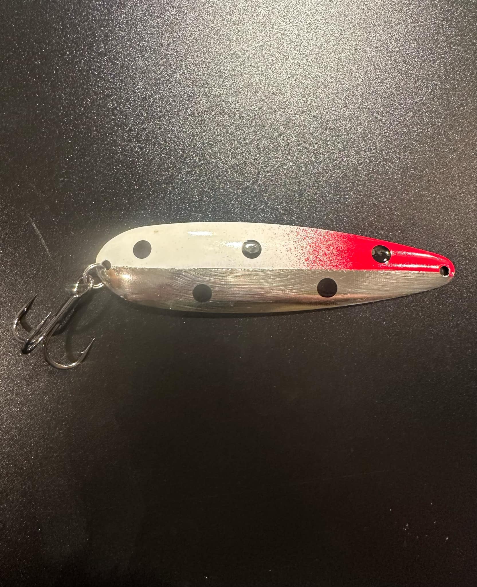 Mercury Trolling Spoon with silver body, red head stripe, black dots, treble hook
