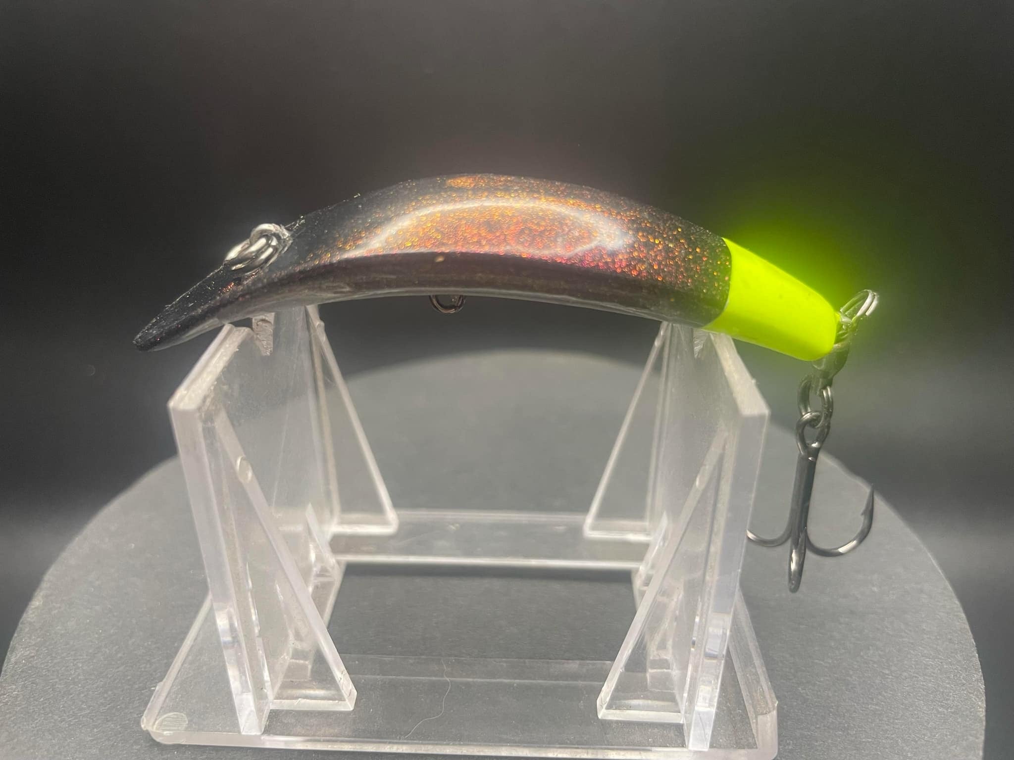 Moonshine UV Glow Swiftfish hardbait with neon green body and treble hook