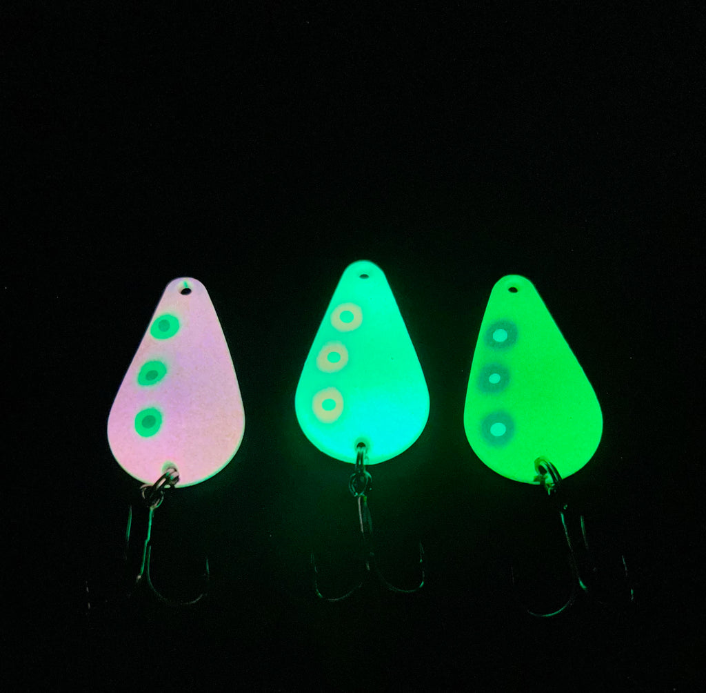 Neptunium Glow TJ Bobbler lures in glowing purple and green, three-pack view