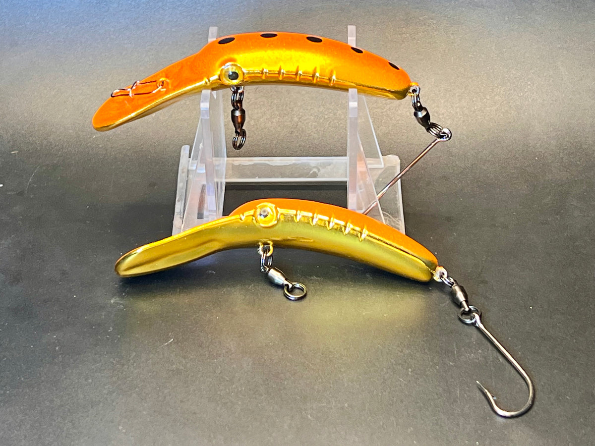 Fishing lure plug pair in orange and gold with treble hooks