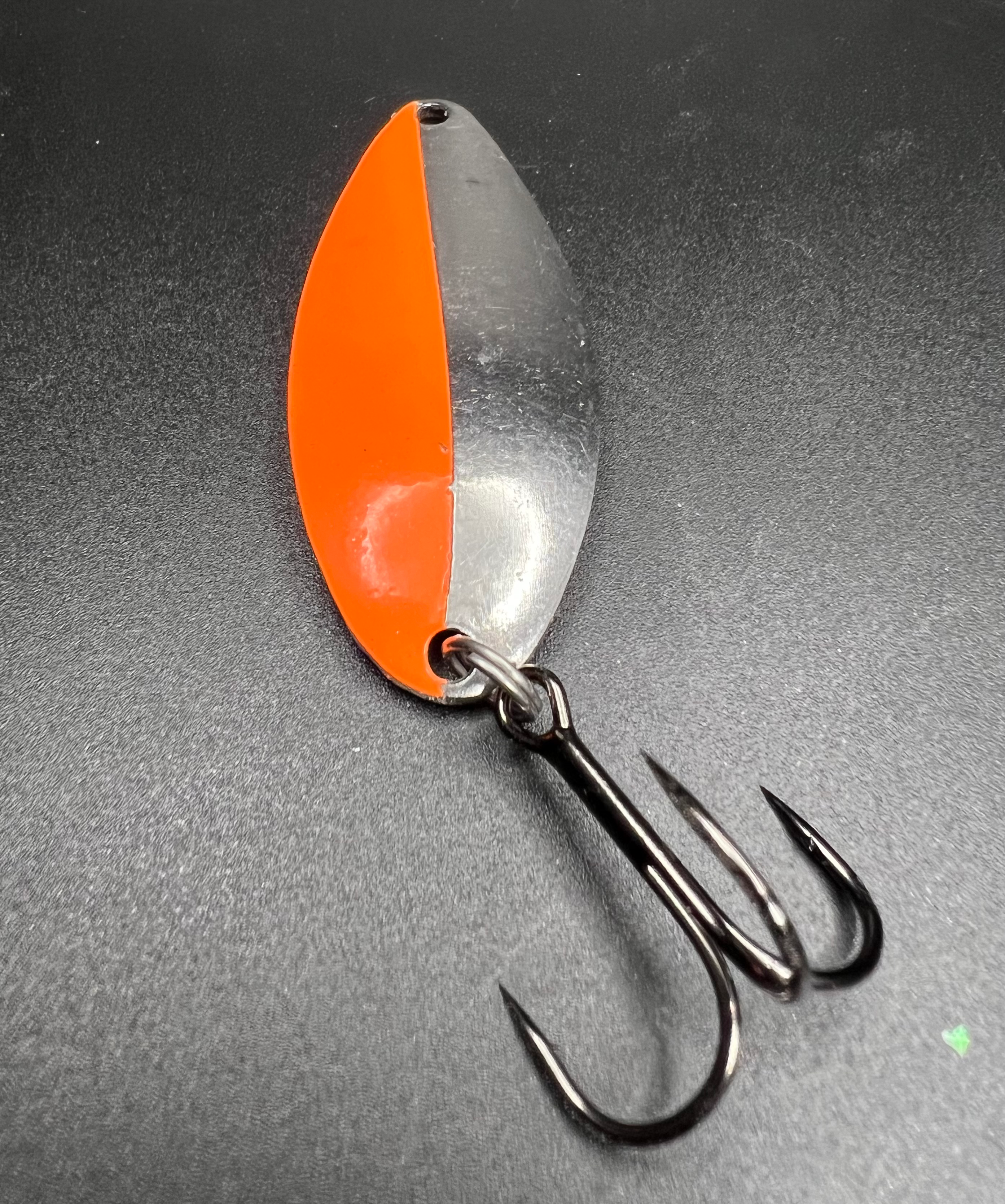 Tangerine Twinkle Little Cletus lure: orange and silver spoon with two treble hooks