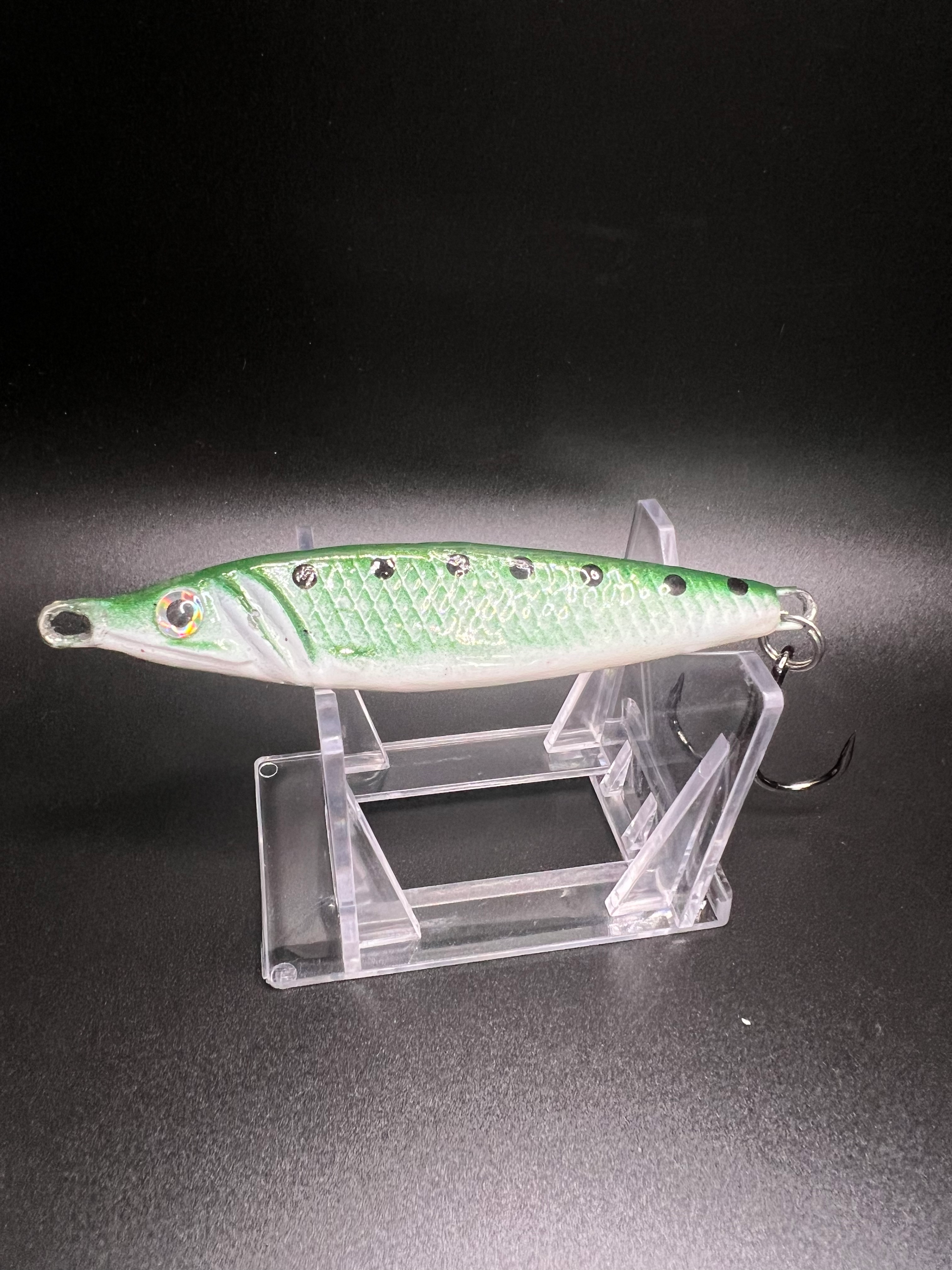 Bass Sabbath UV jigging spoon, green top with white belly, metal treble hook
