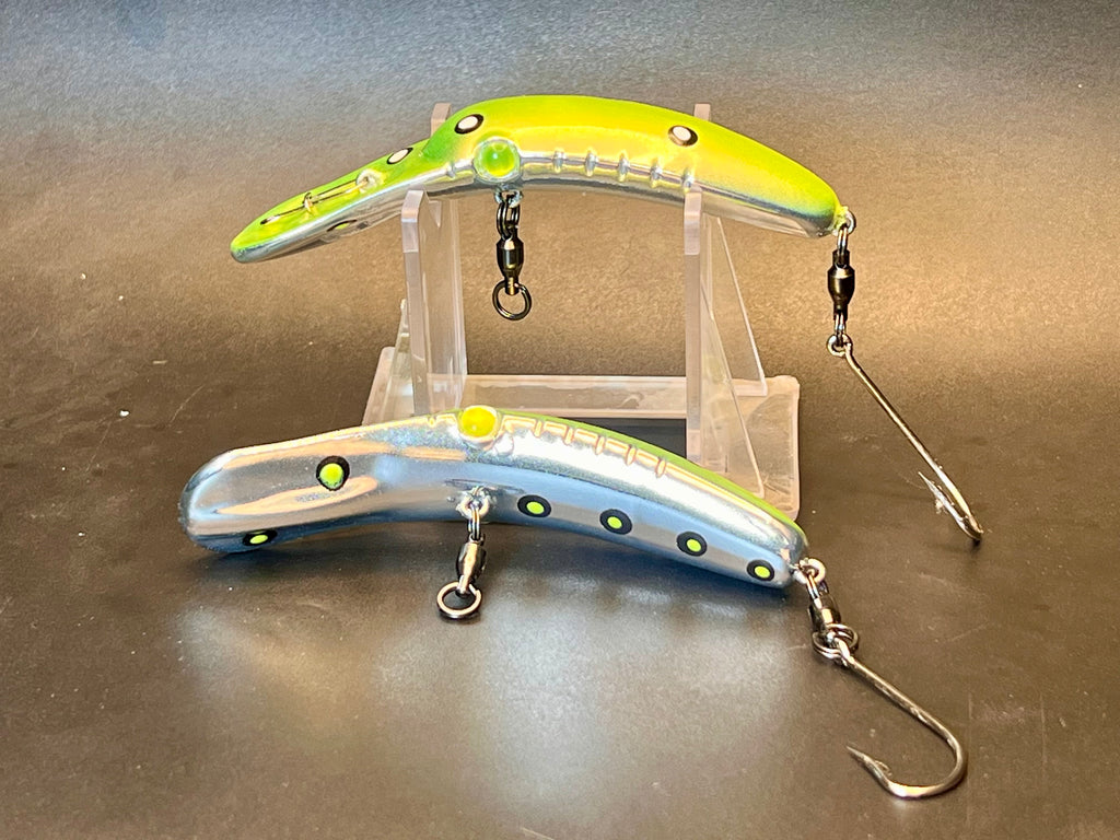 Fishing lure plugs, one yellow-green and one light blue with treble hooks