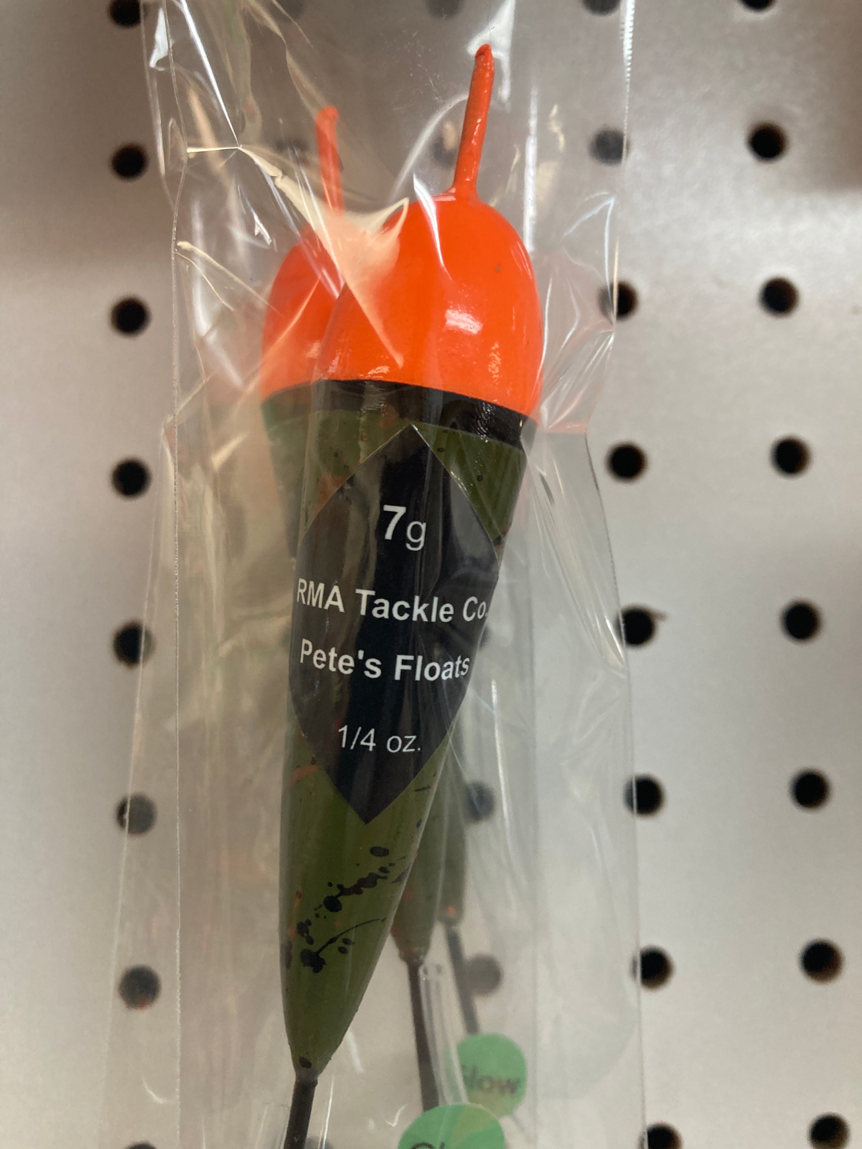 Fishing float in clear bag, orange cap with black band, dark green body, 7g