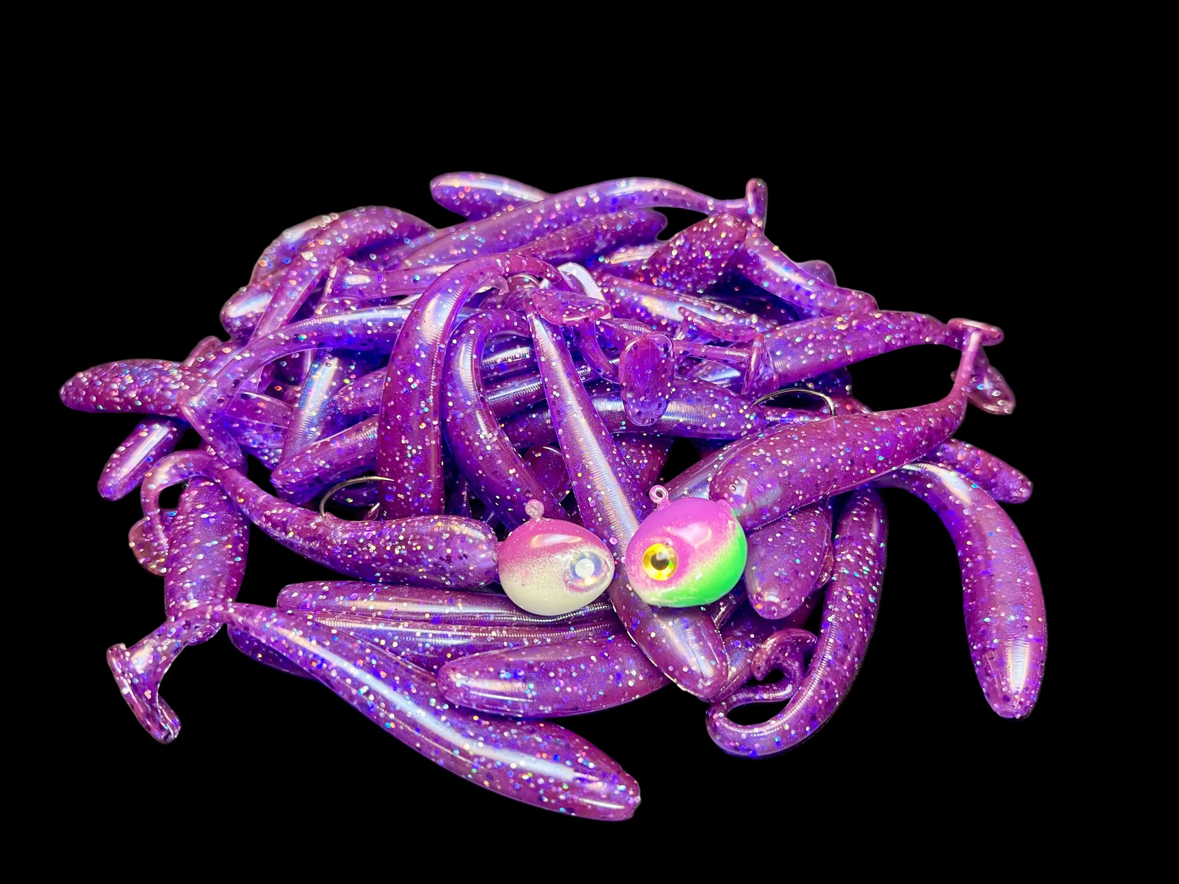 Purple glitter paddle tail swimbaits with round jig heads