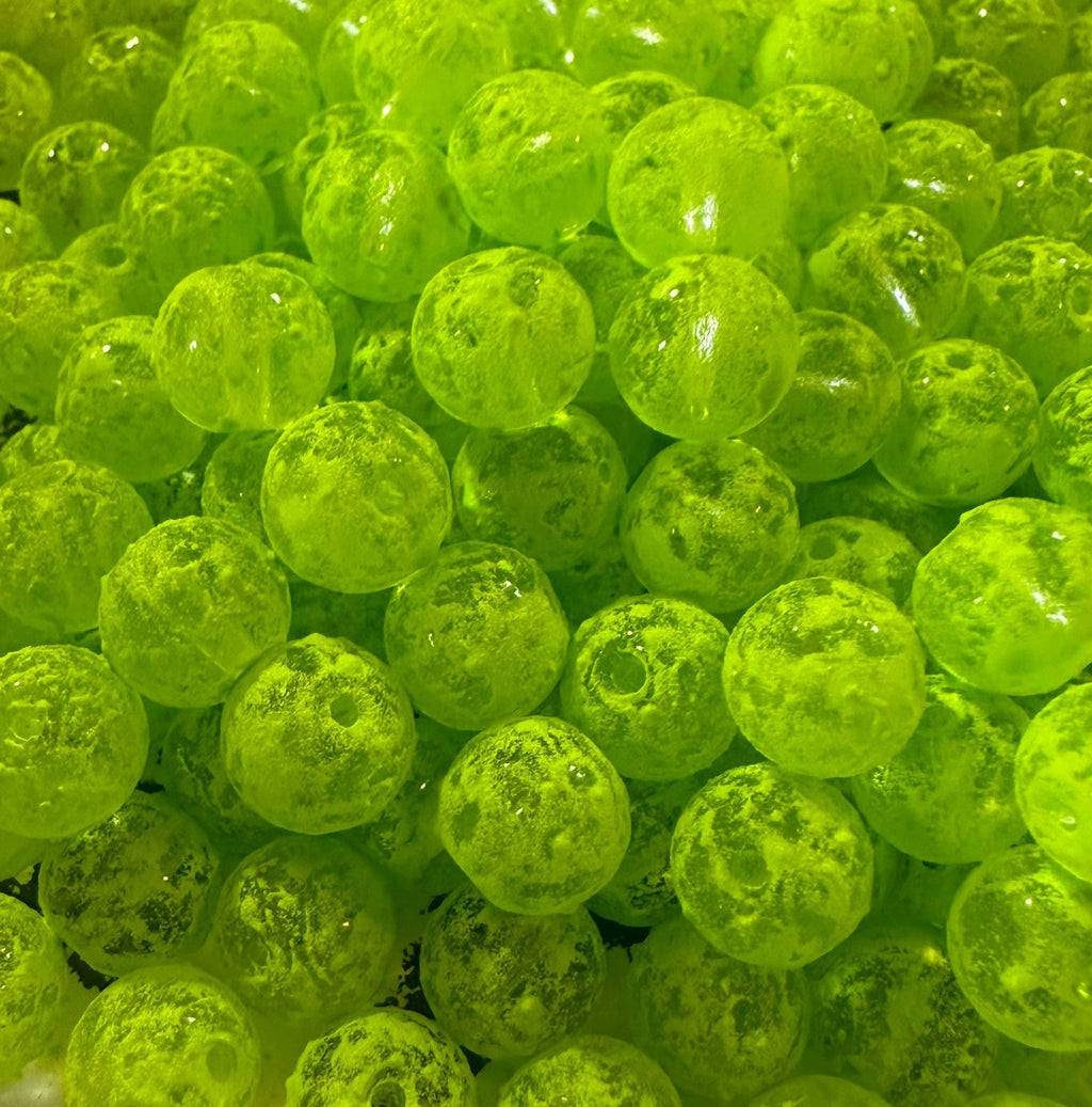 Green glass fishing beads, spherical with central hole