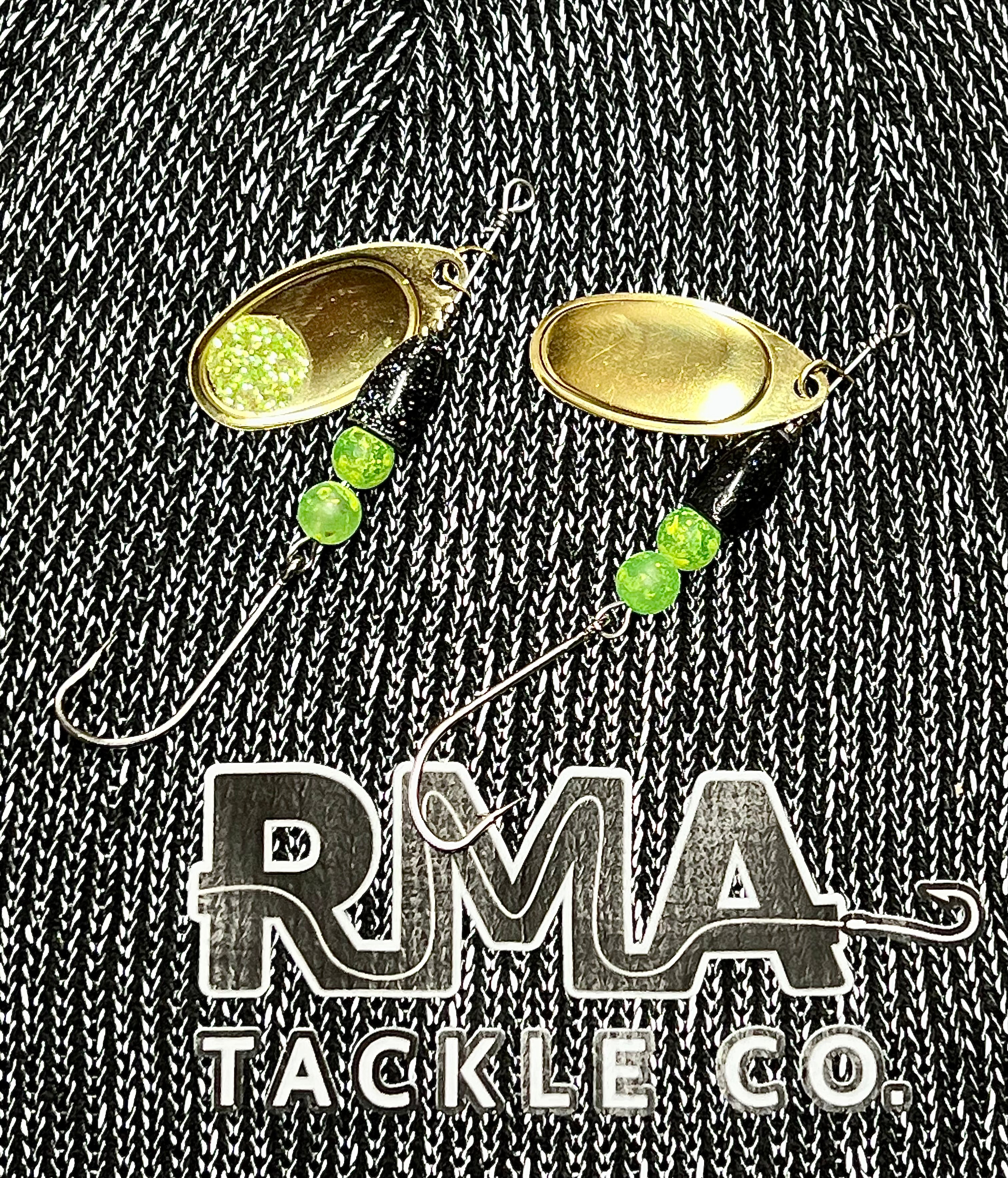 Inline spinner fishing lure with two gold oval blades and green bead dangles
