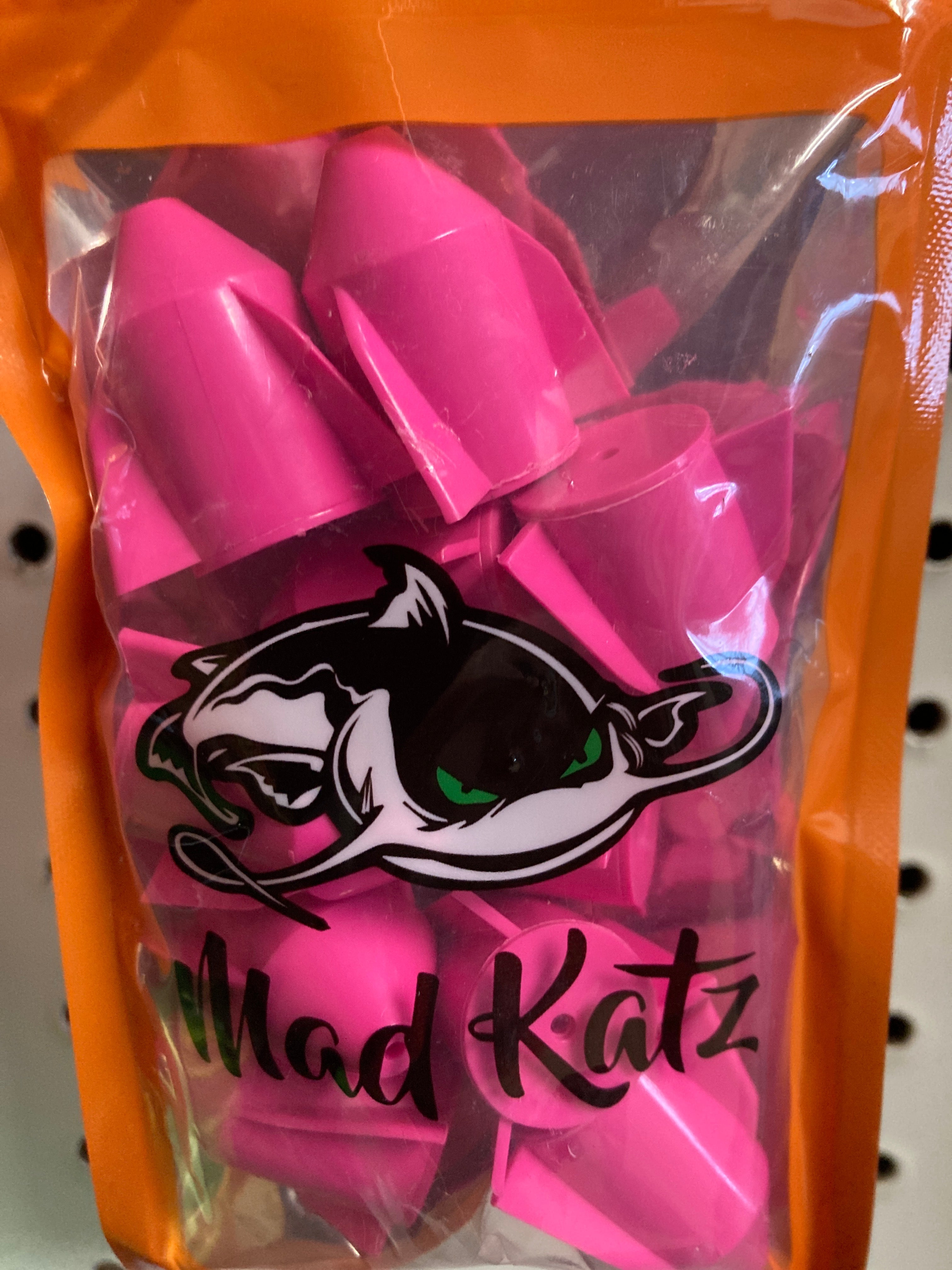 Pink rocket rattle toy with cat graphic, packaged in clear sleeve