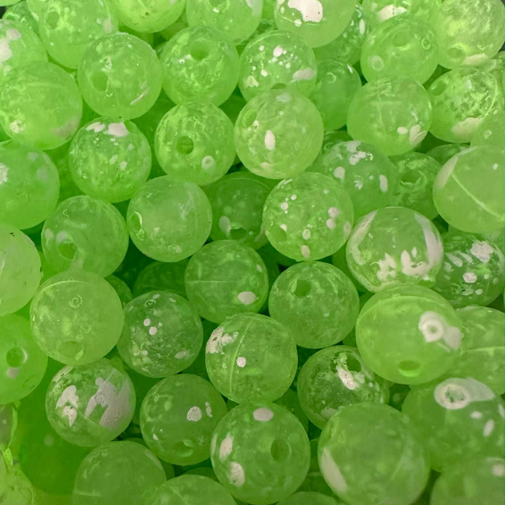 Gooseberry UV glow plastic fishing beads in bright green with white speckles