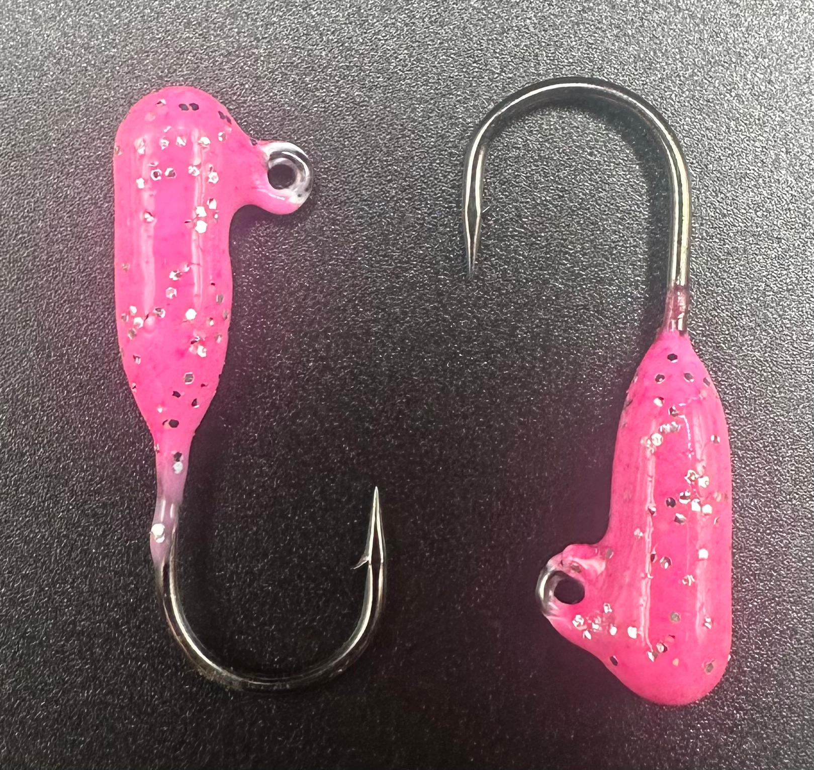Steelhead tube jig set: two pink jig tubes with black specks and double hooks