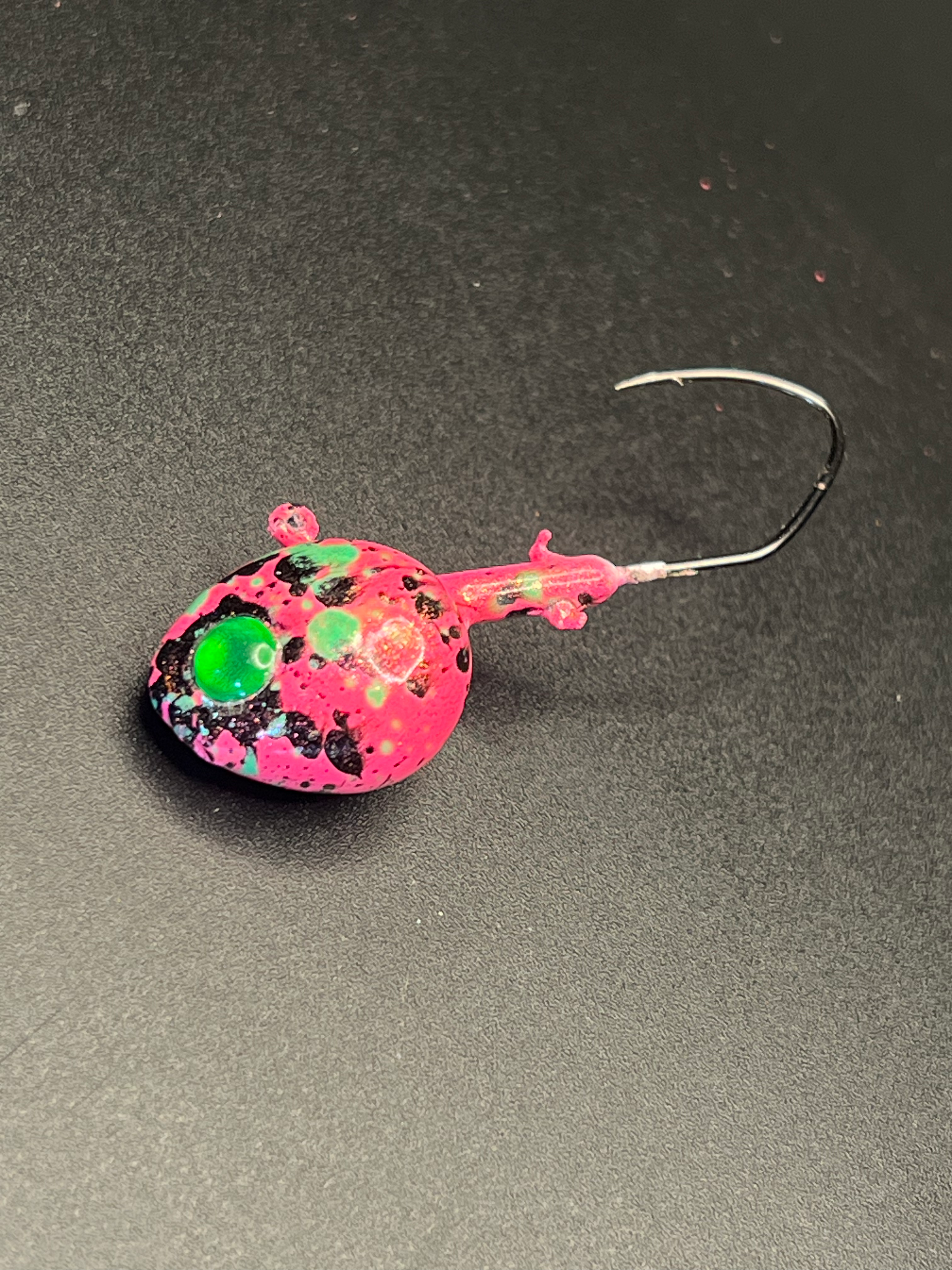 UV Walleye Jig in pink with green eye and speckled finish, single hook