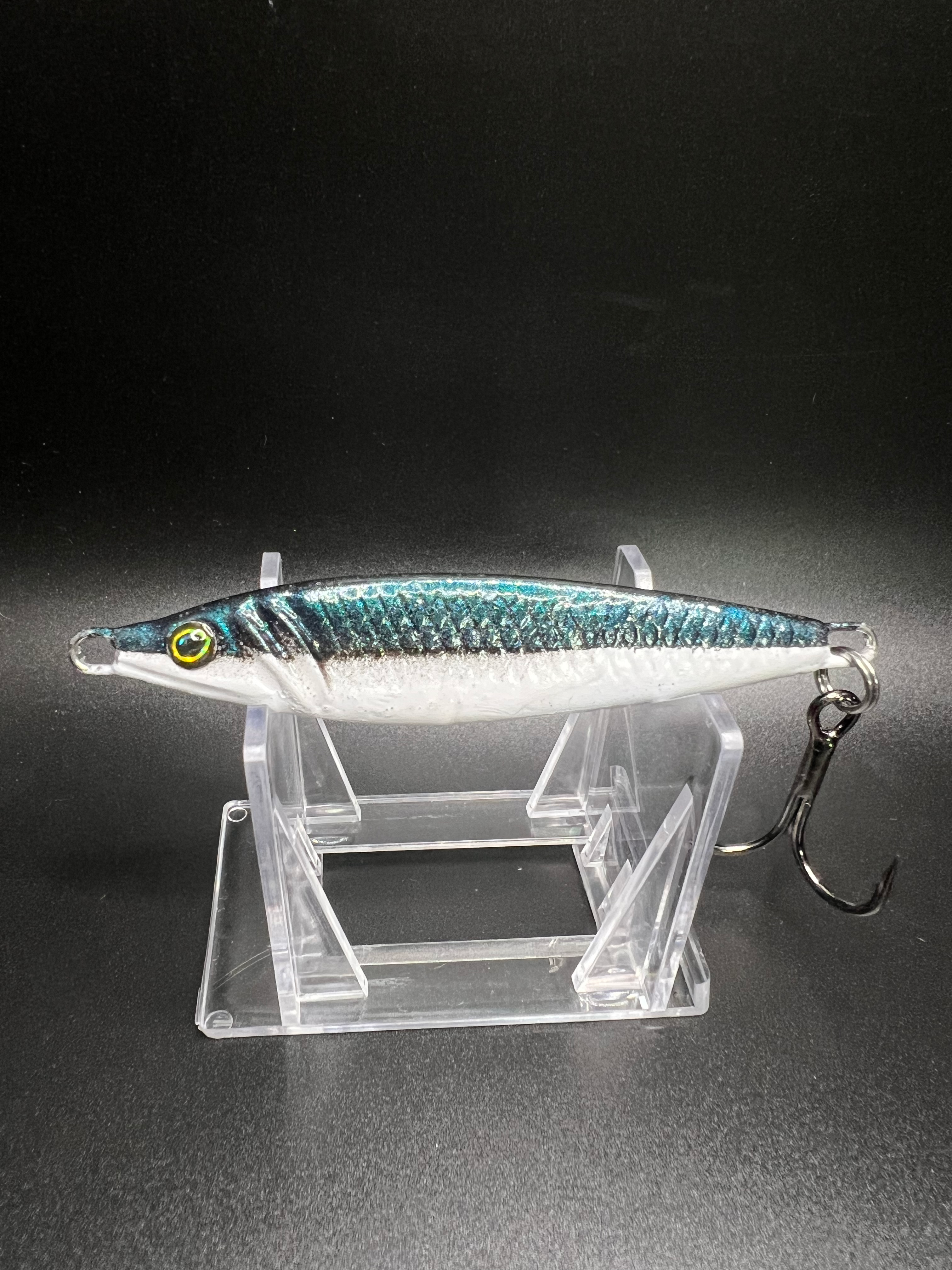 2 oz jigging spoon in silver-blue with chartreuse eye and treble hook