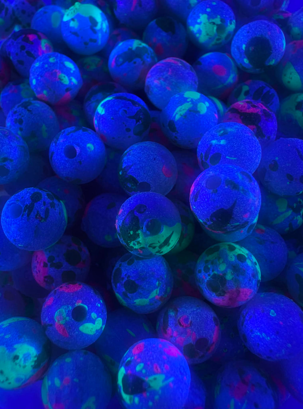 UV glow fishing beads: blue glowing round beads with neon green and pink specks