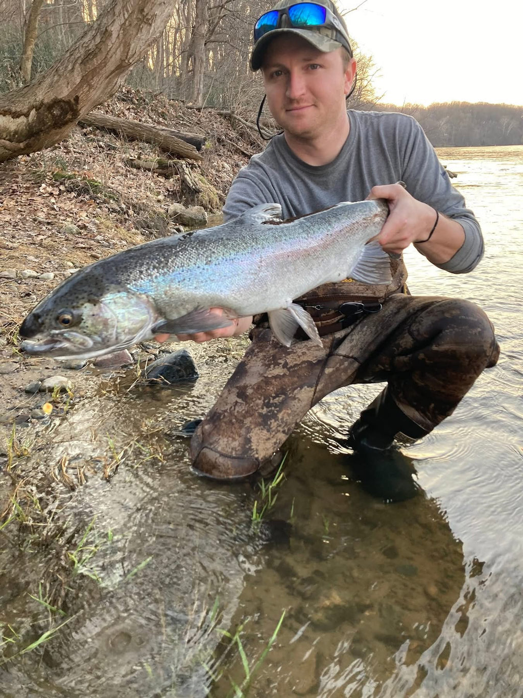 Steelhead/salmon-style fish with a UV-glow bead on the line near the head
