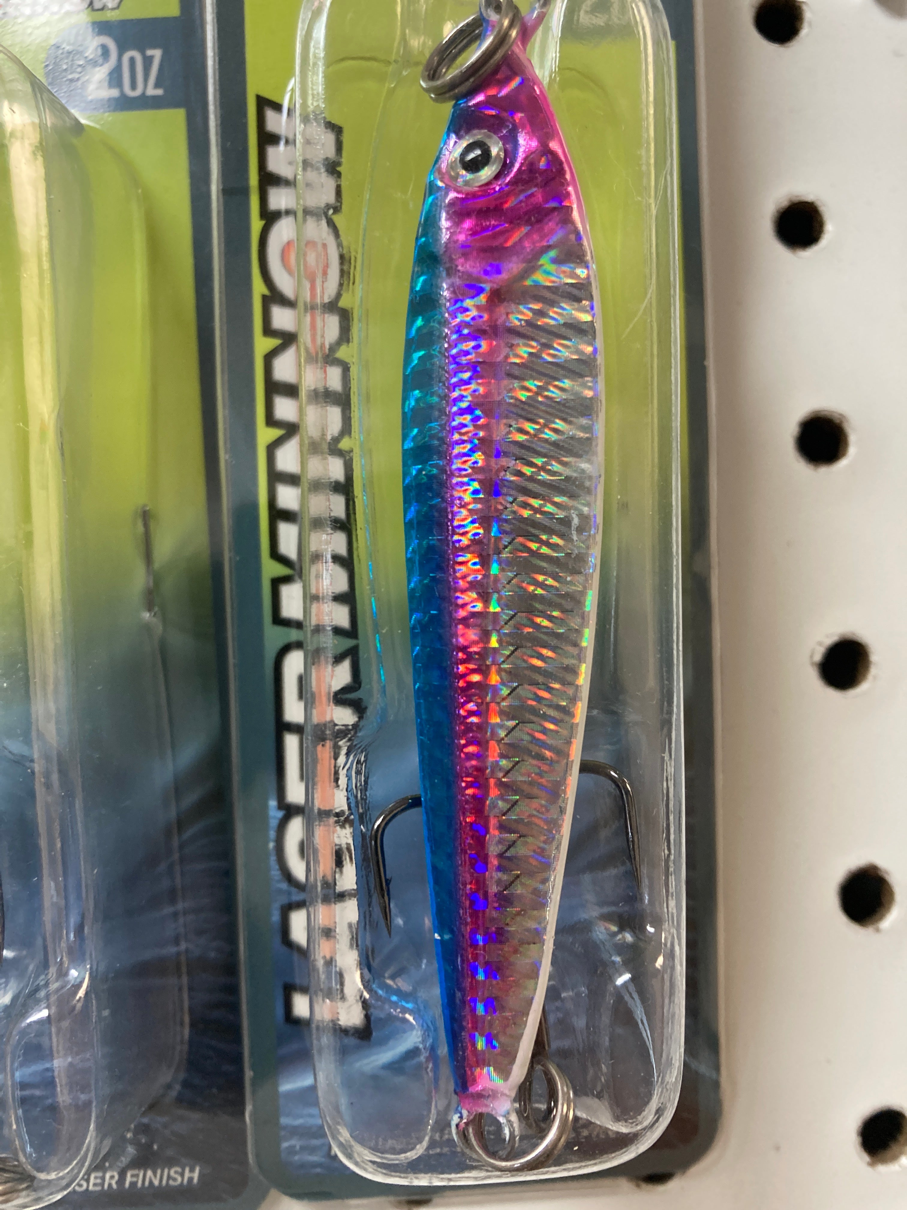 Holographic pink and blue jigging spoon with silver hook and split ring