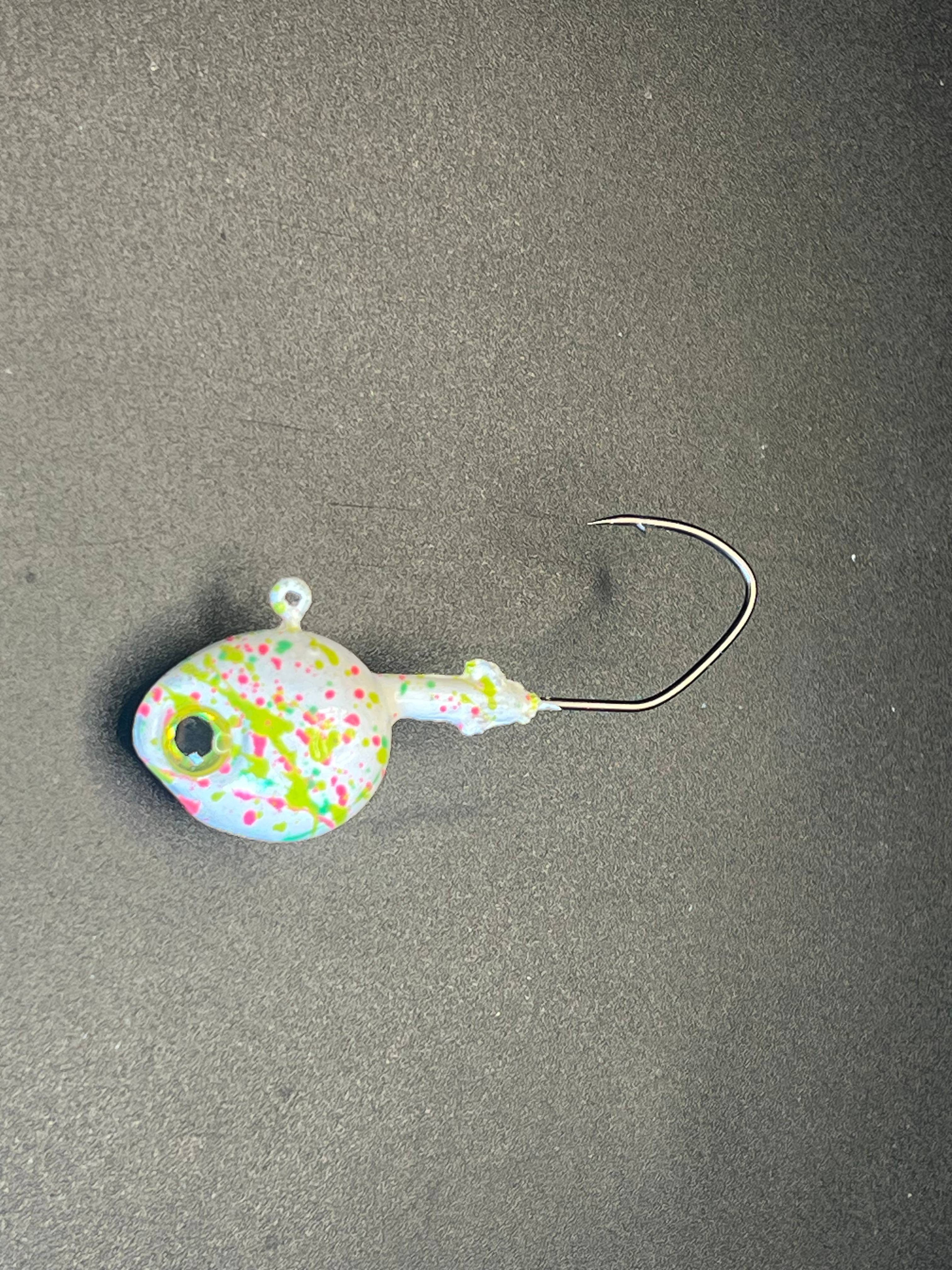 Moldy Splat UV Glow walleye jig—yellow-green with multicolor speckles, single hook