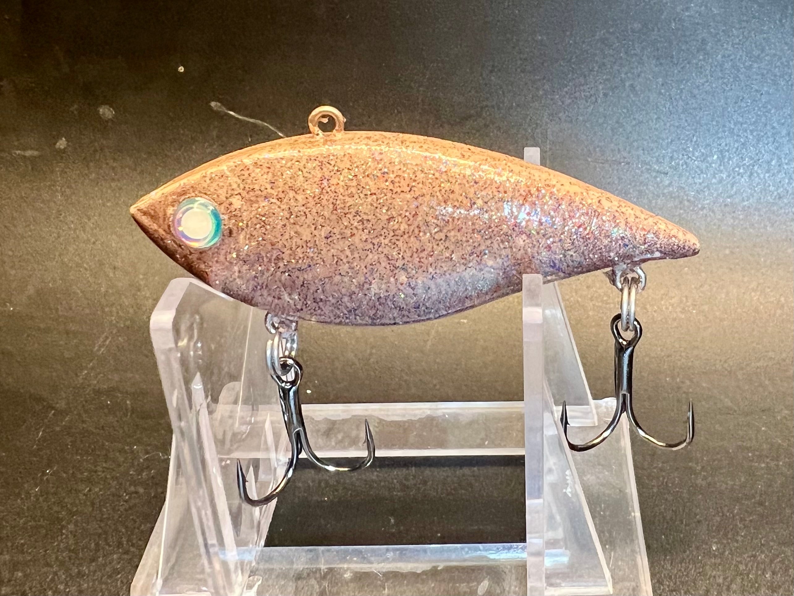 Trap House Shad lure with purple speckled body, blue eye and two treble hooks