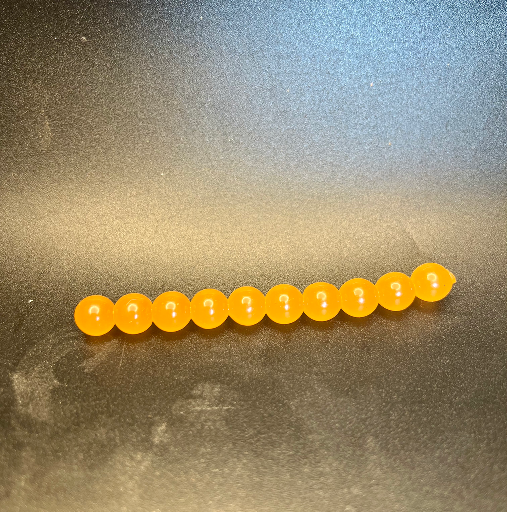 Orange soft plastic fishing beads, longer 10-bead row for salmon & steelhead